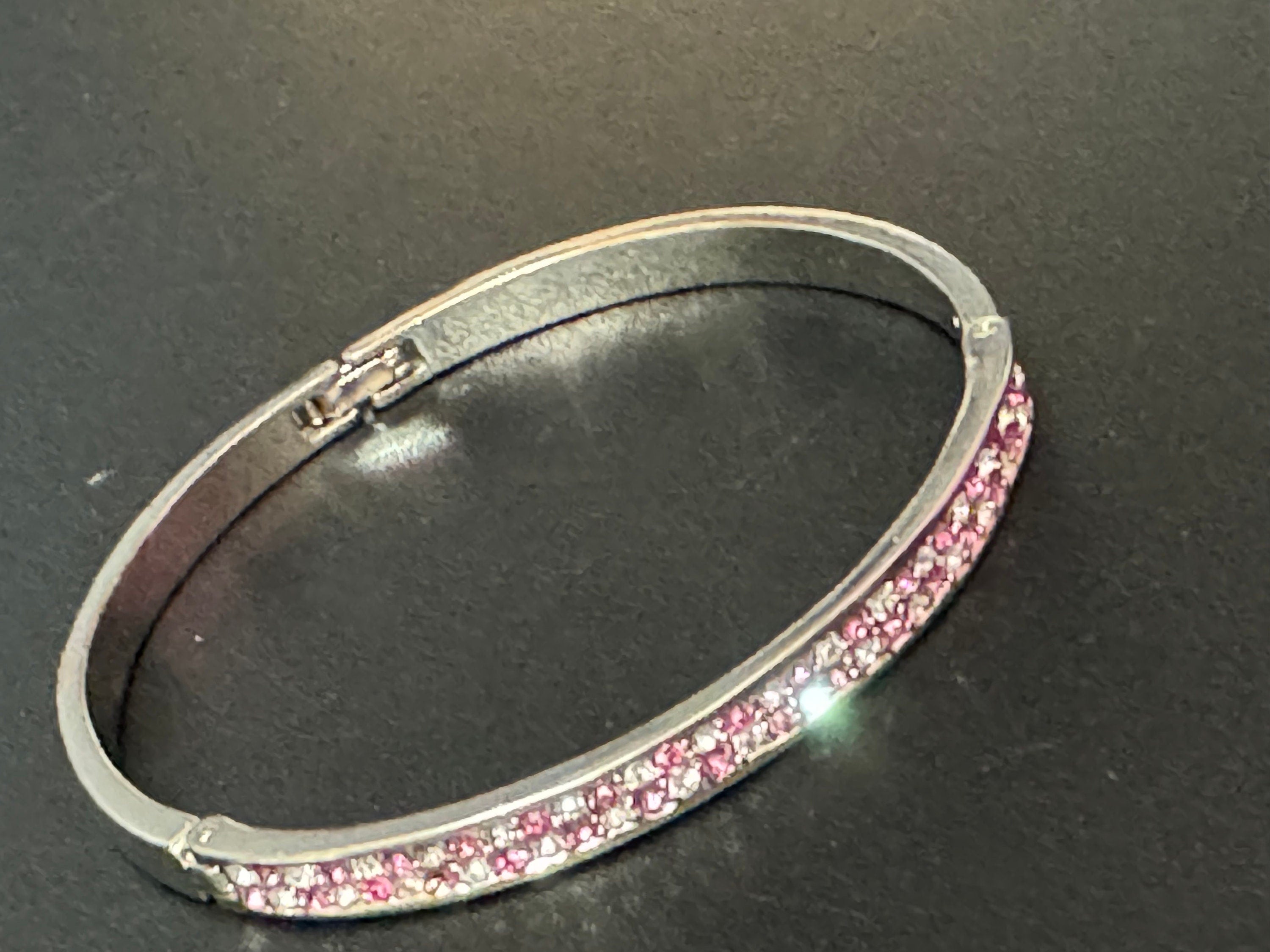 Vintage slim silver tone hinged bangle bracelet with pink glass rhinestones crystals