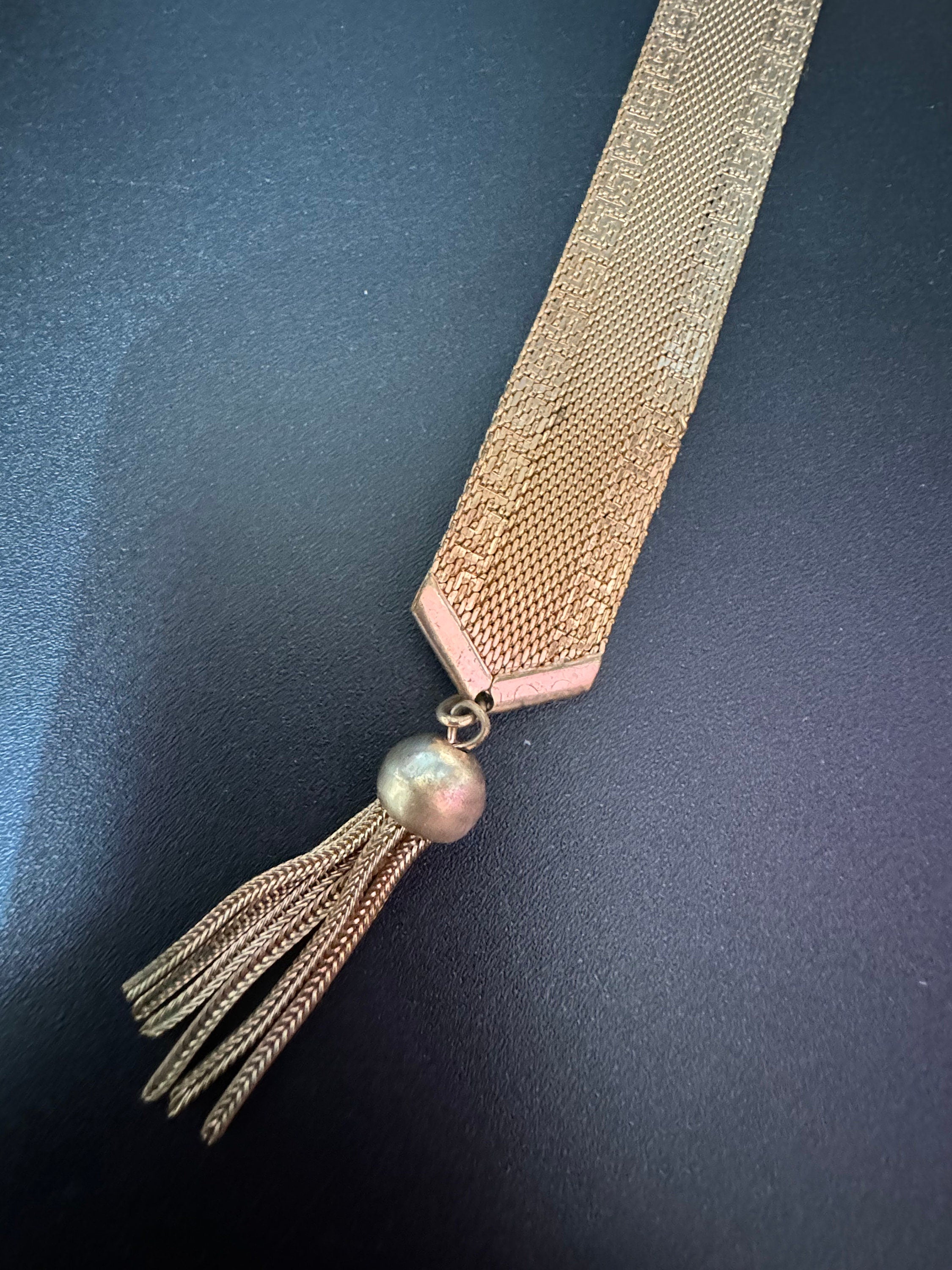 1970s Greek key design gold tone articulated flat 2cm wide tassel bracelet 19cm