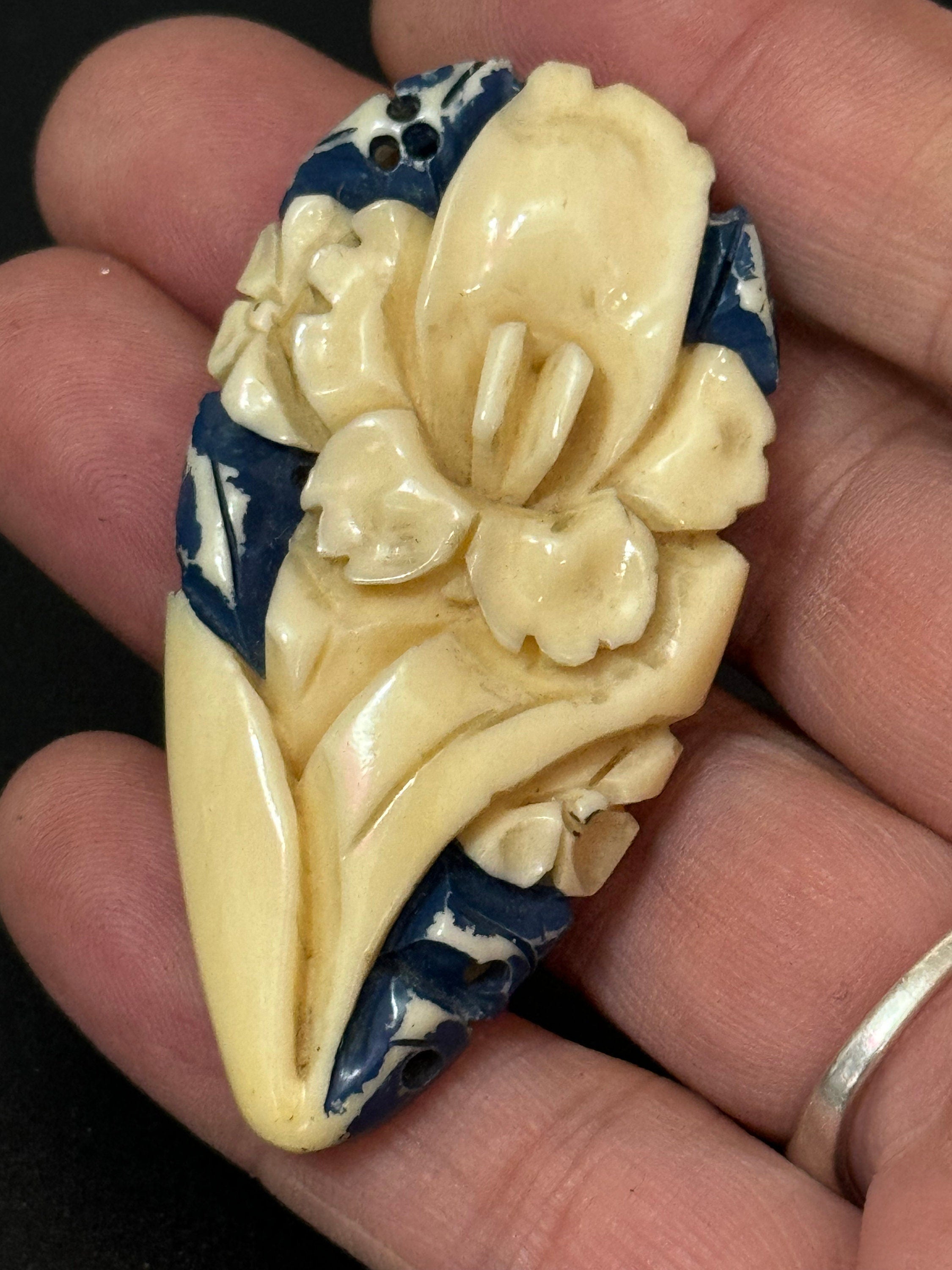 Early Plastic cream and blue carved Celluloid ladies single dress clip