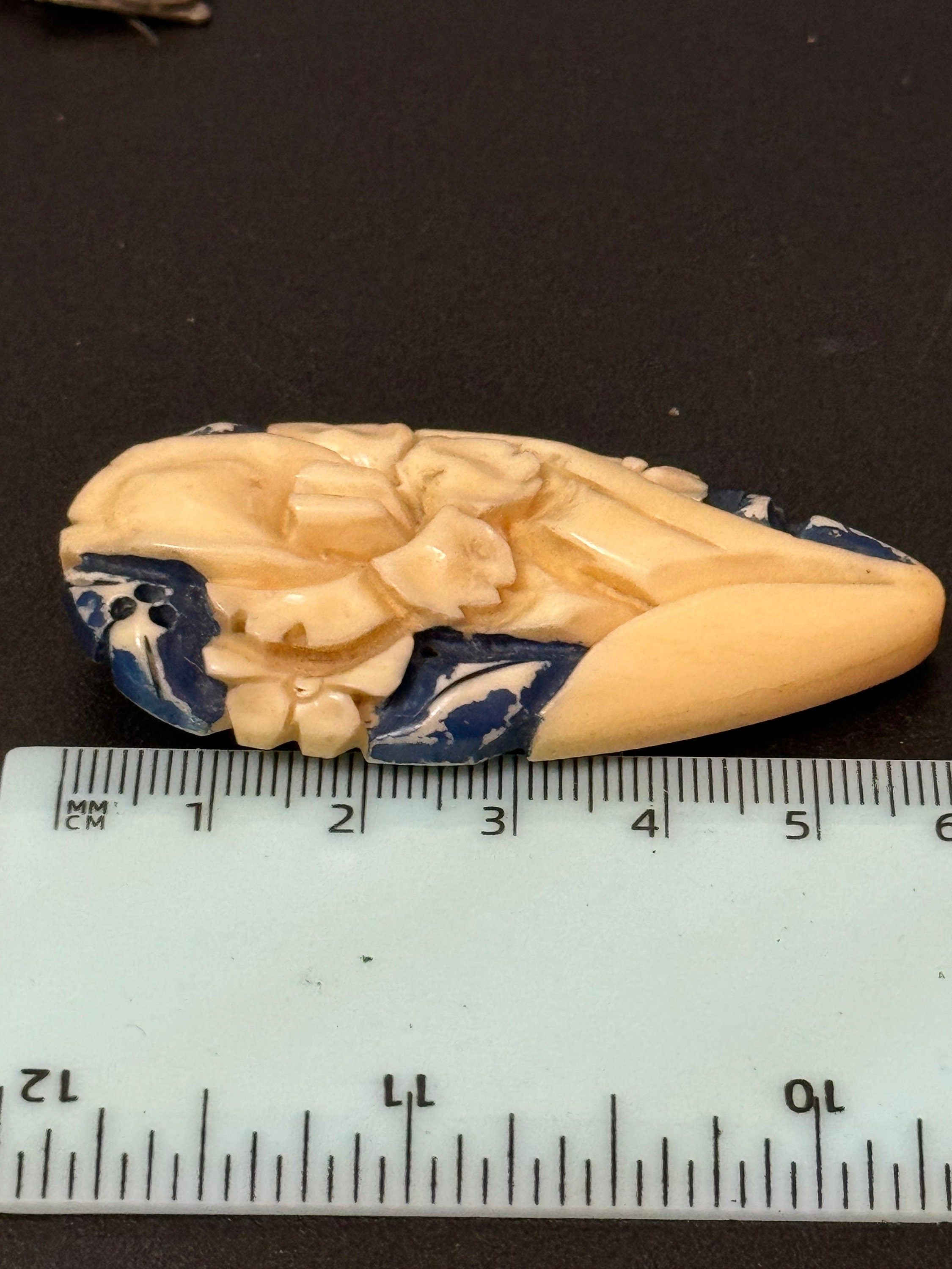 Early Plastic cream and blue carved Celluloid ladies single dress clip