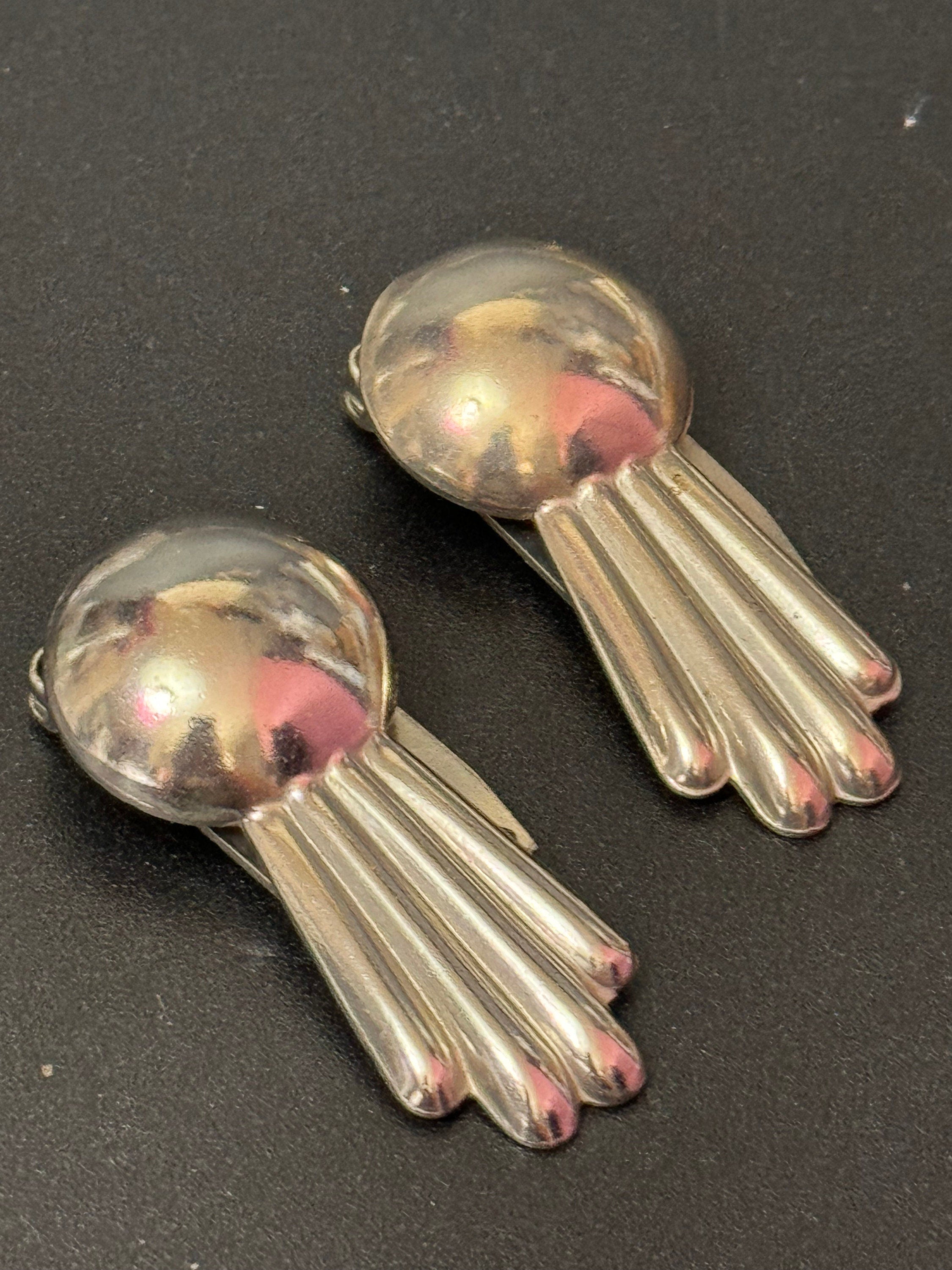 A pair of Art Deco Geometric Silver Chrome dress Clips metal
