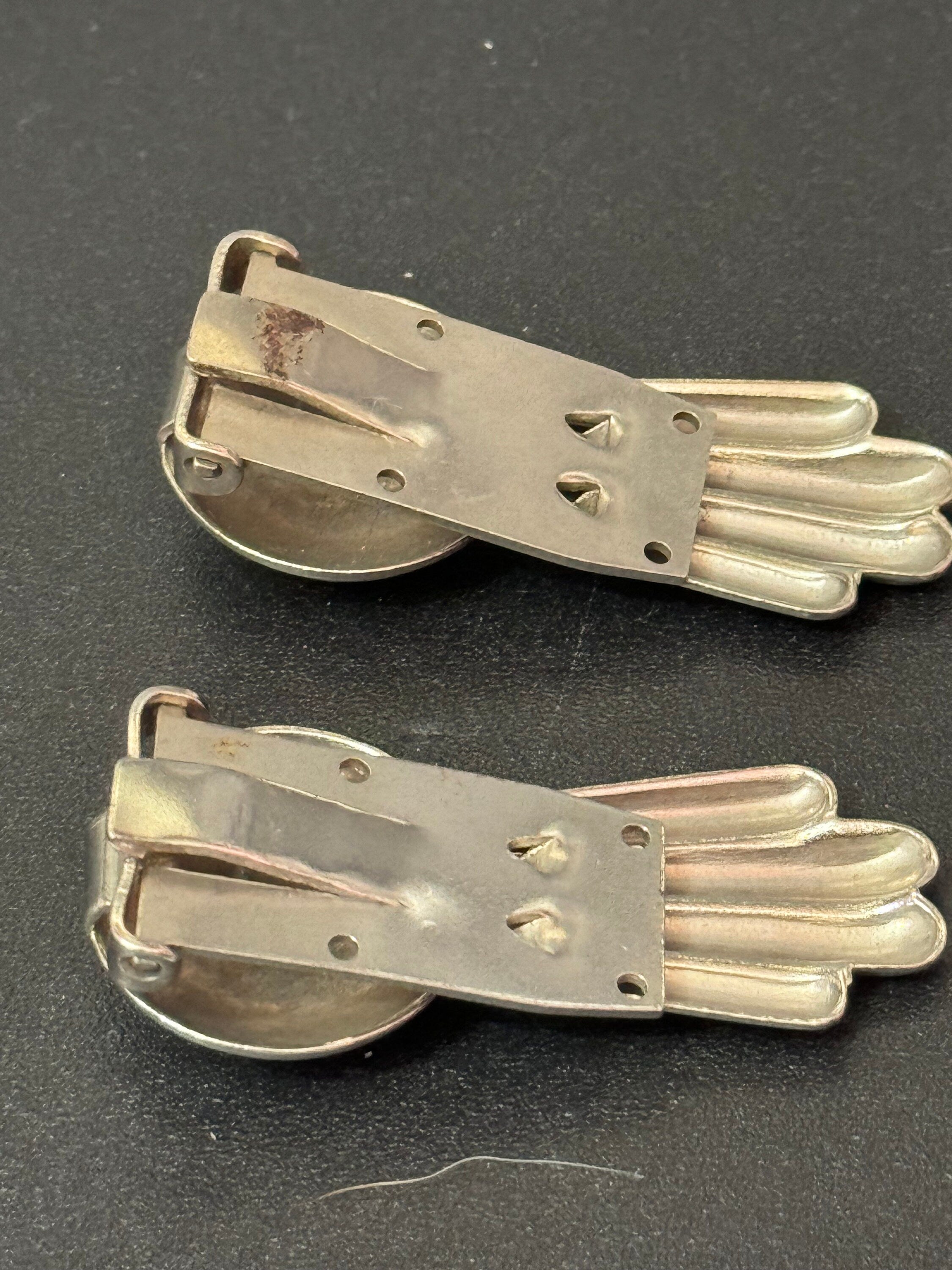 A pair of Art Deco Geometric Silver Chrome dress Clips metal