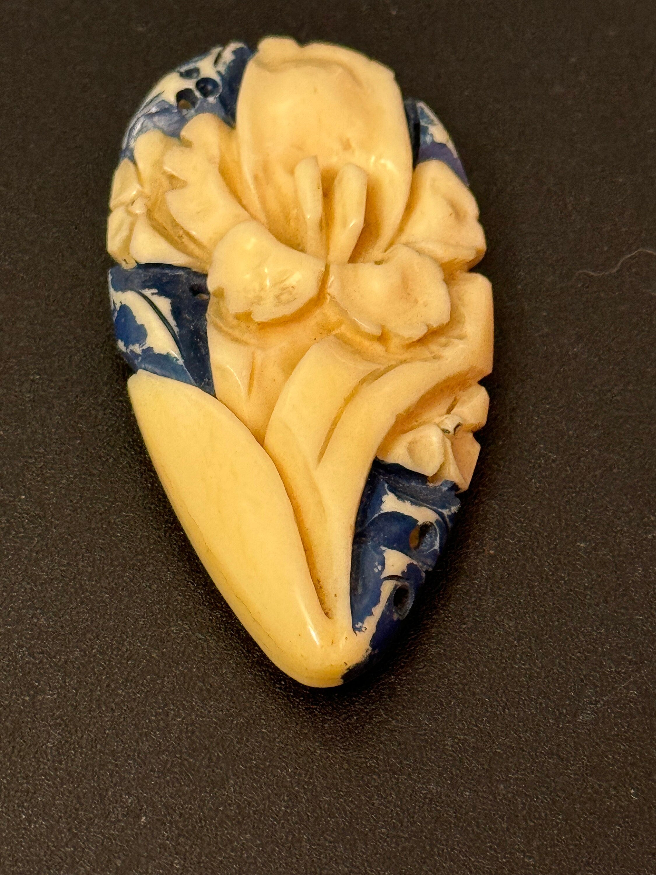 Early Plastic cream and blue carved Celluloid ladies single dress clip
