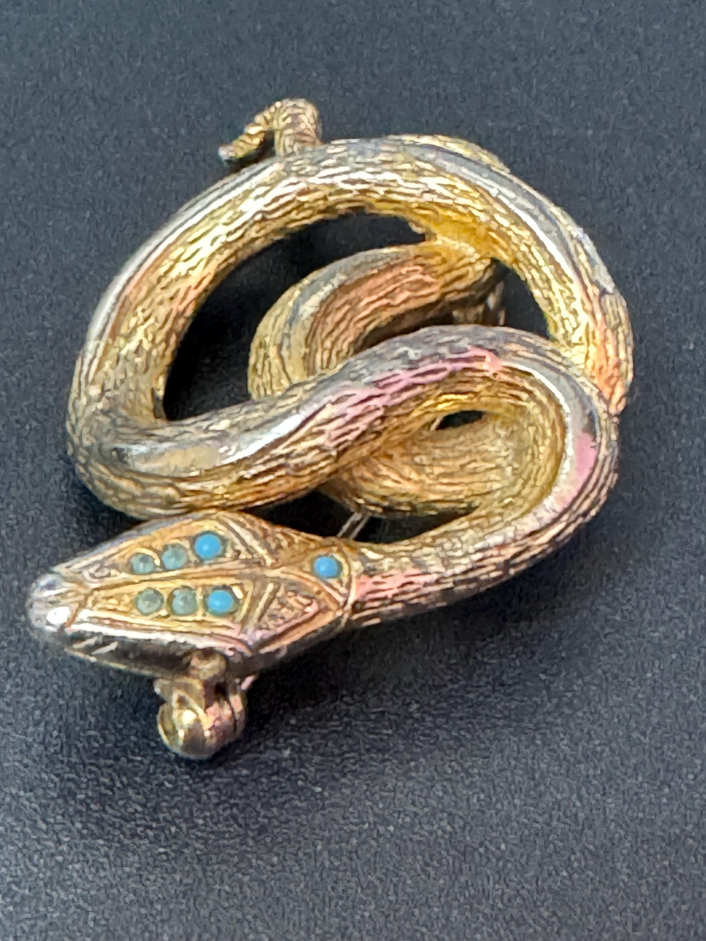 Signed sphinx Vintage gold tone snake brooch with emerald paste eyes vintage Some colour fade