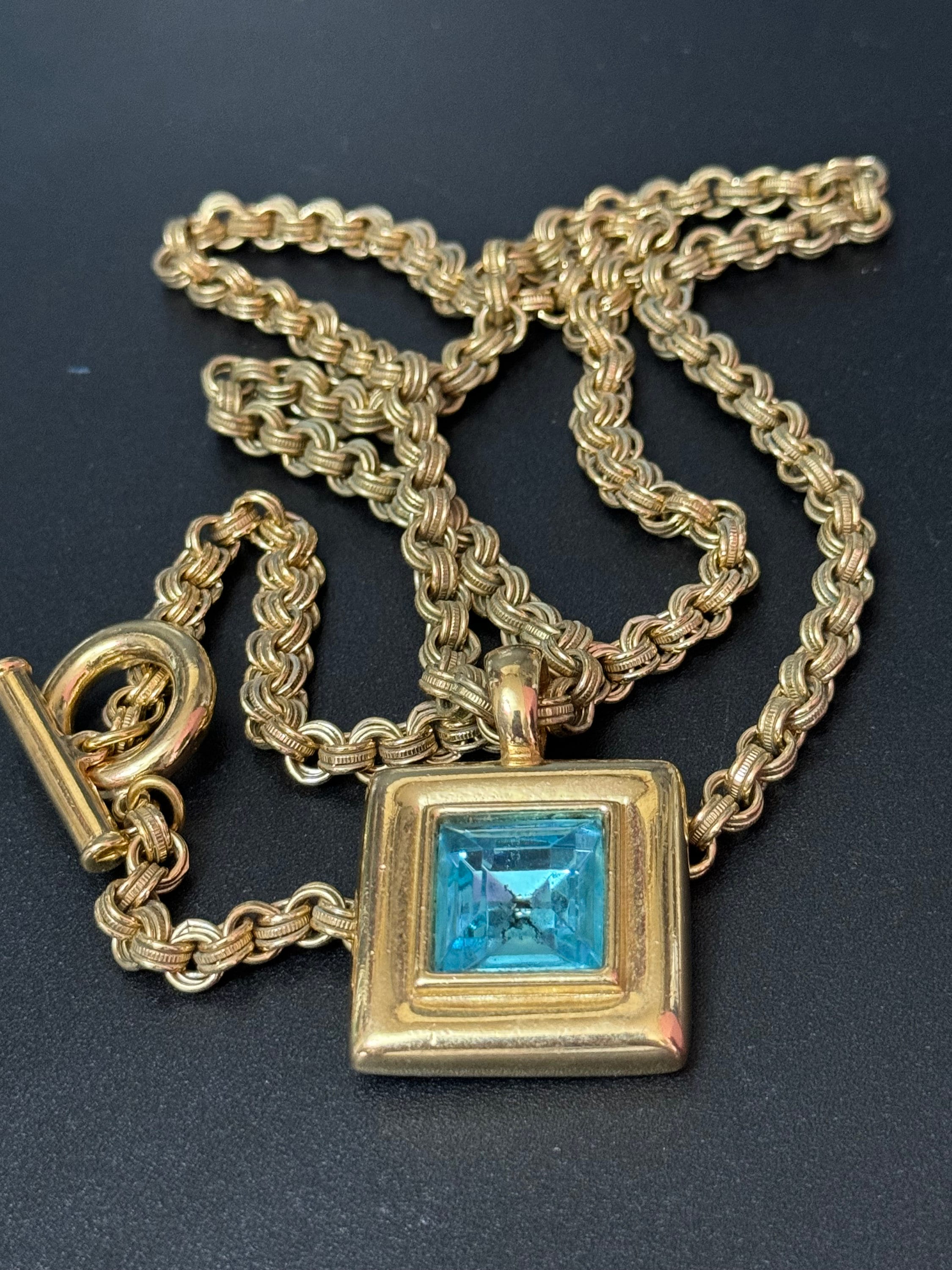 Circa 1980s Givenchy, gold plated square turquoise blue crystal pendant necklace on signed 80cm toggle chain, New York designer