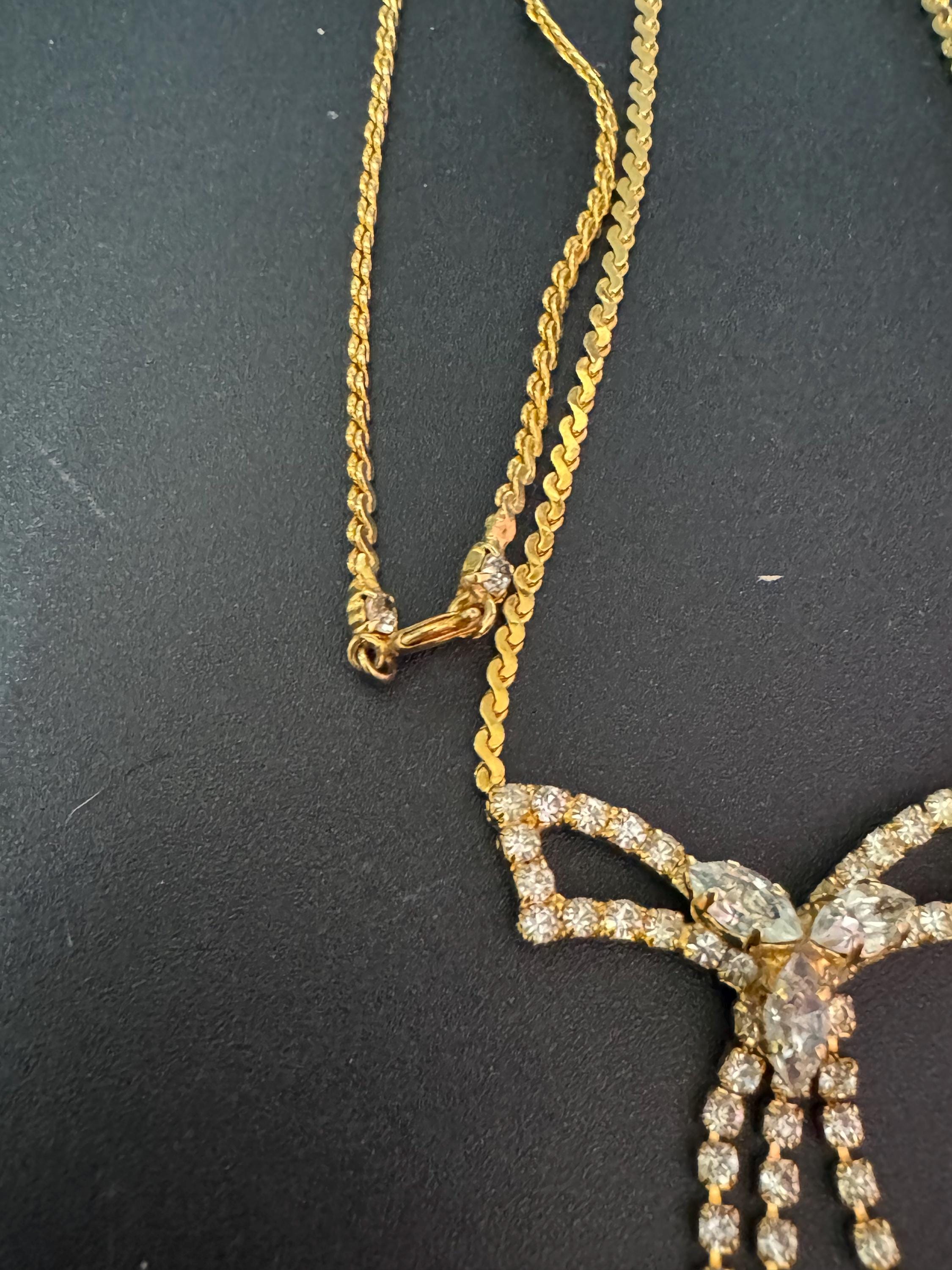 Vintage gold tone serpentine chain lariat drop bow necklace with clear diamanté glass paste stones