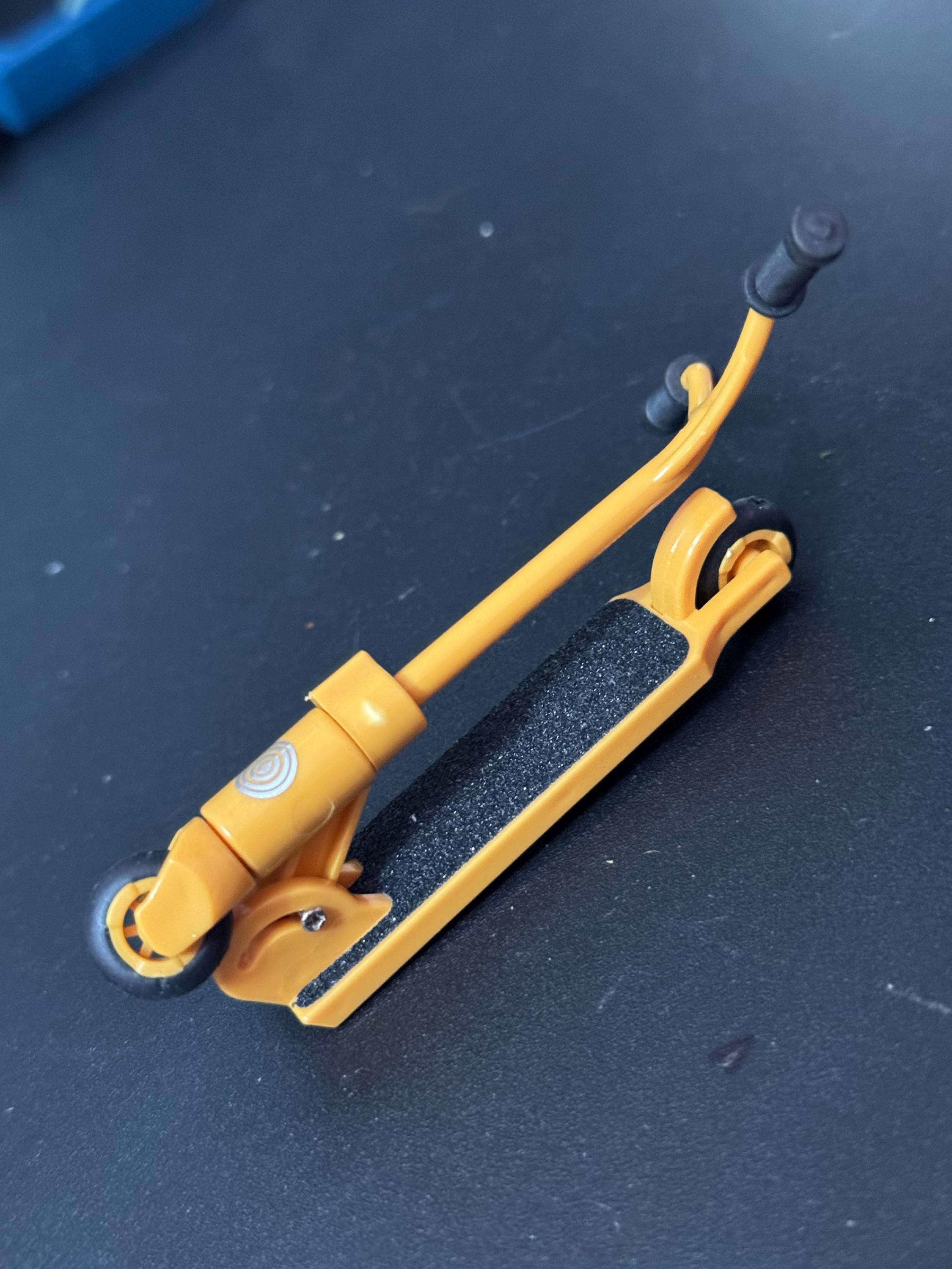 Miniature folding scooter cake topper decoration choice of colours plastic finger operated Childs toy
