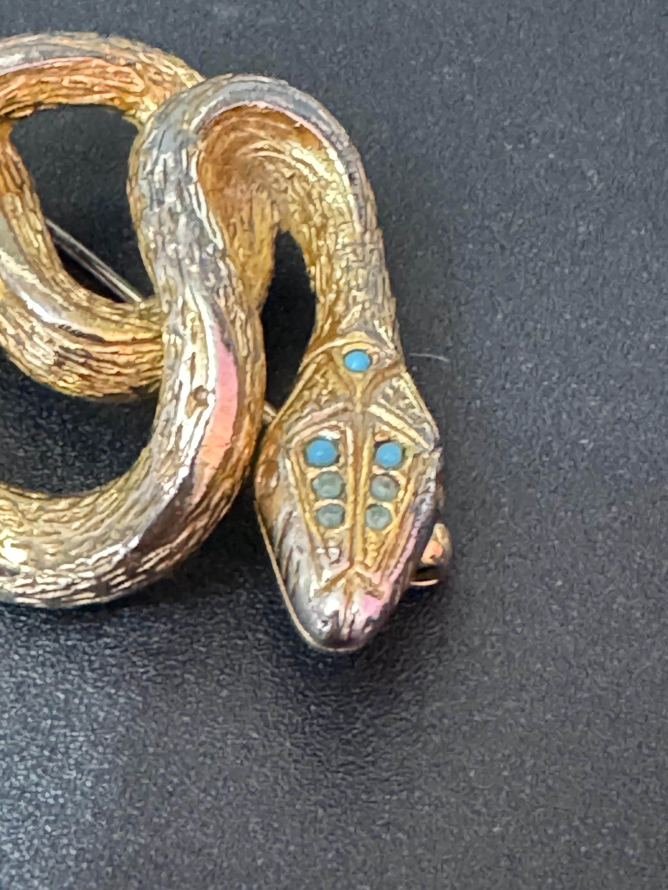 Signed sphinx Vintage gold tone snake brooch with turquoise blue eyes vintage