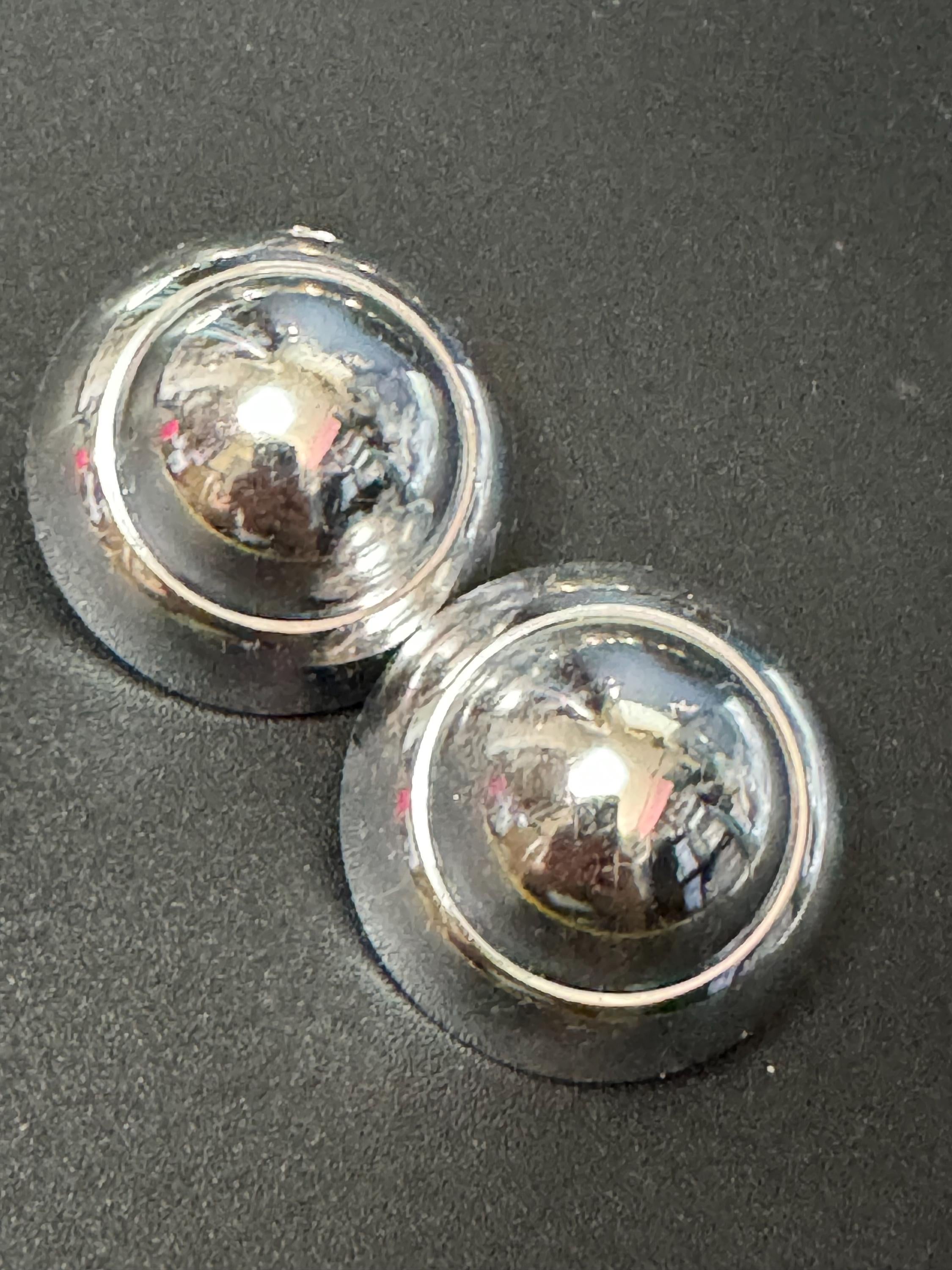 Silver tone clip on dome earrings