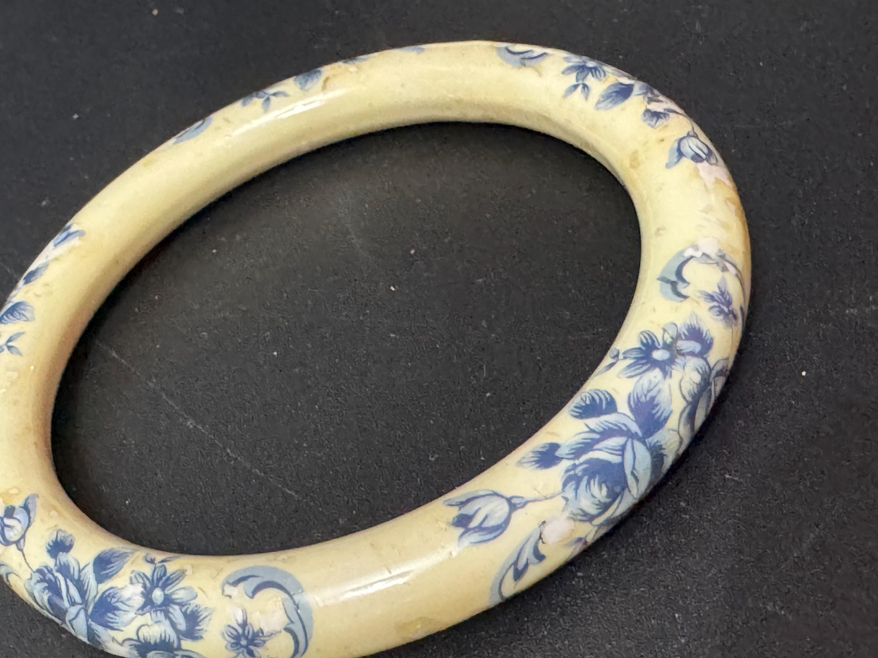 Antique ceramic Art Deco Period Cream bangle bracelet transfer printed with blue floral roses