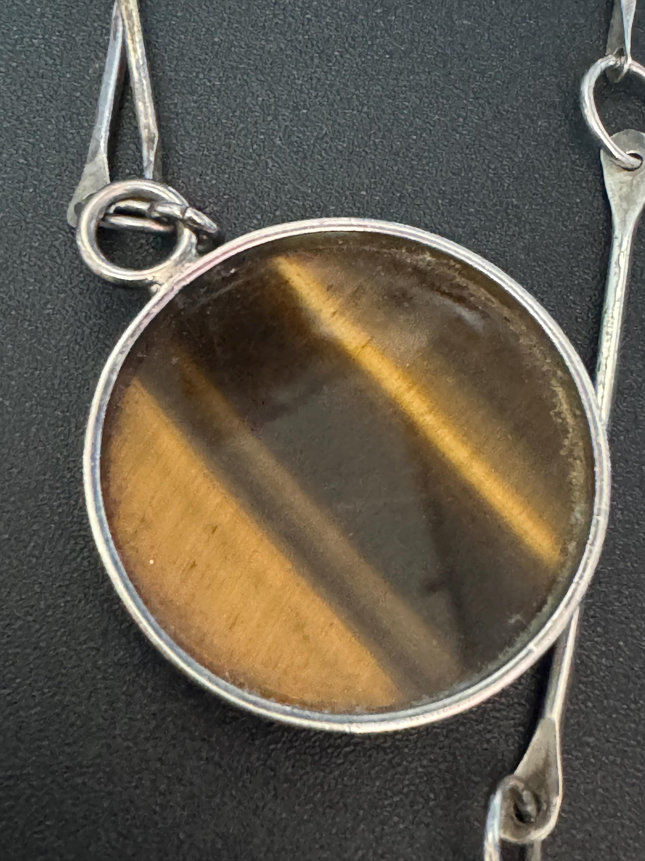 Solid silver long tigers eye round pendant necklace on 75cm chain 917 grade Naples or Malta 1970s weighs 25.5 grams