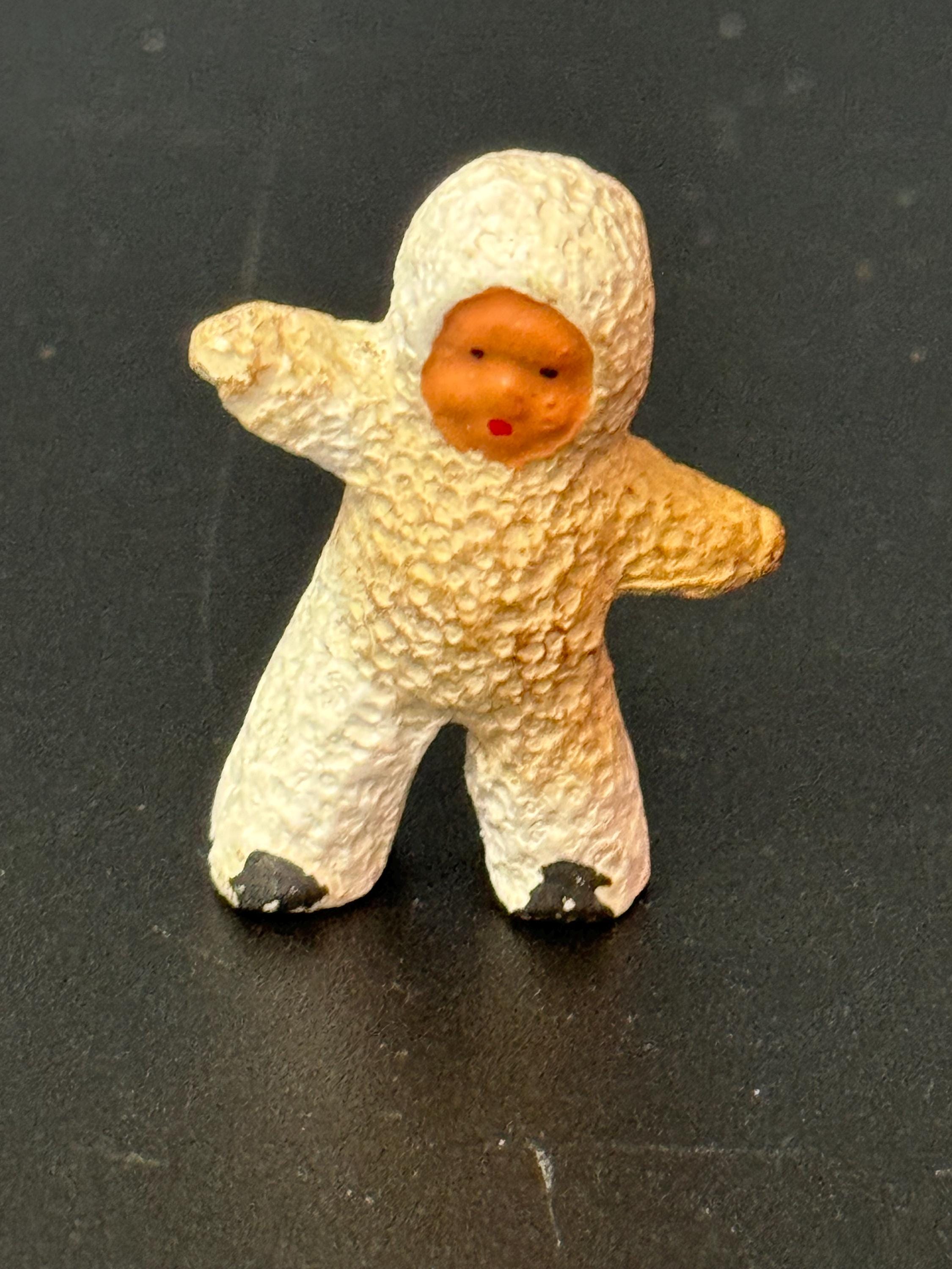 Vintage bisque snow baby cake topper