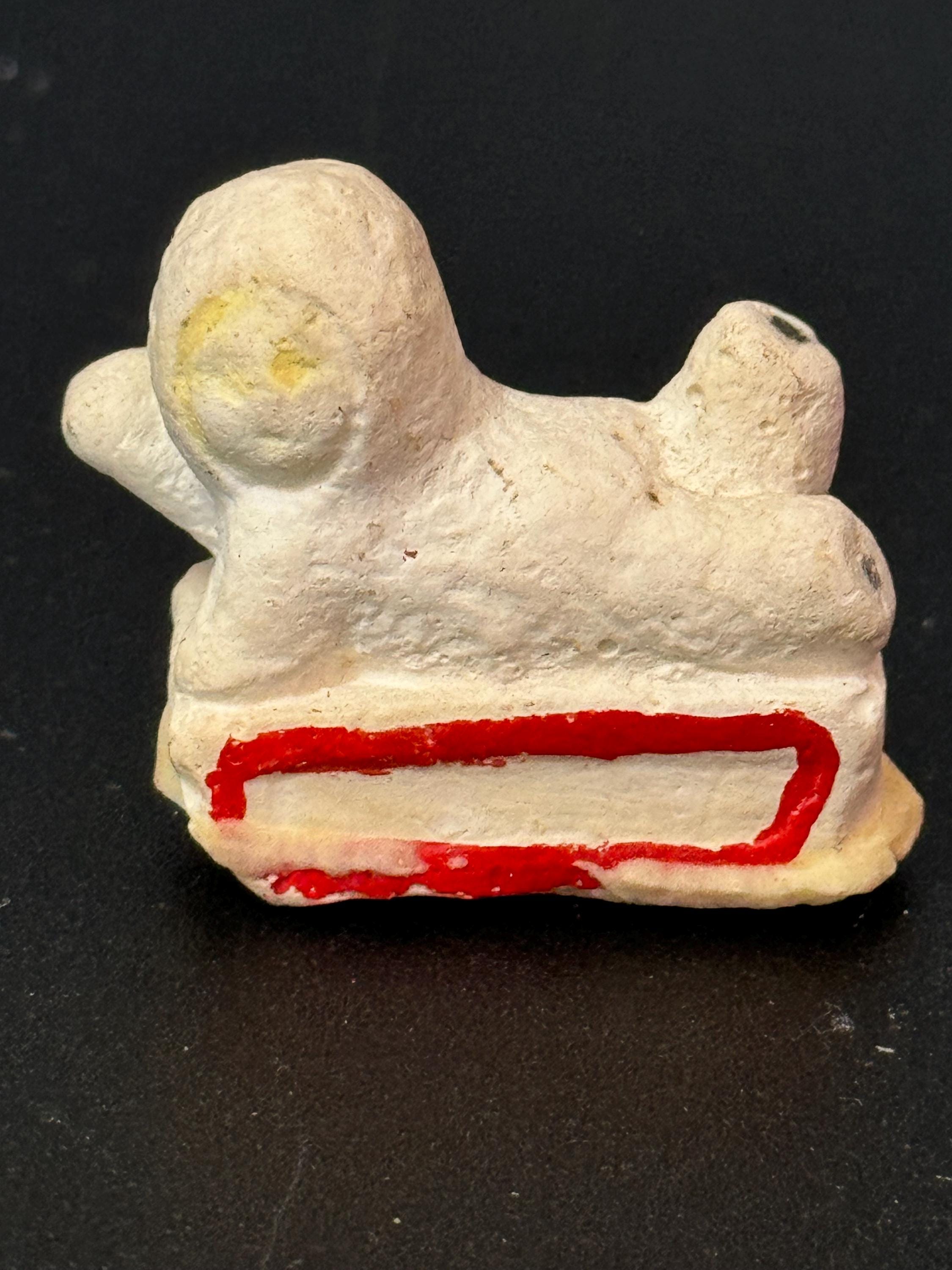 Bisque snow baby boy on sledge sleigh cake topper