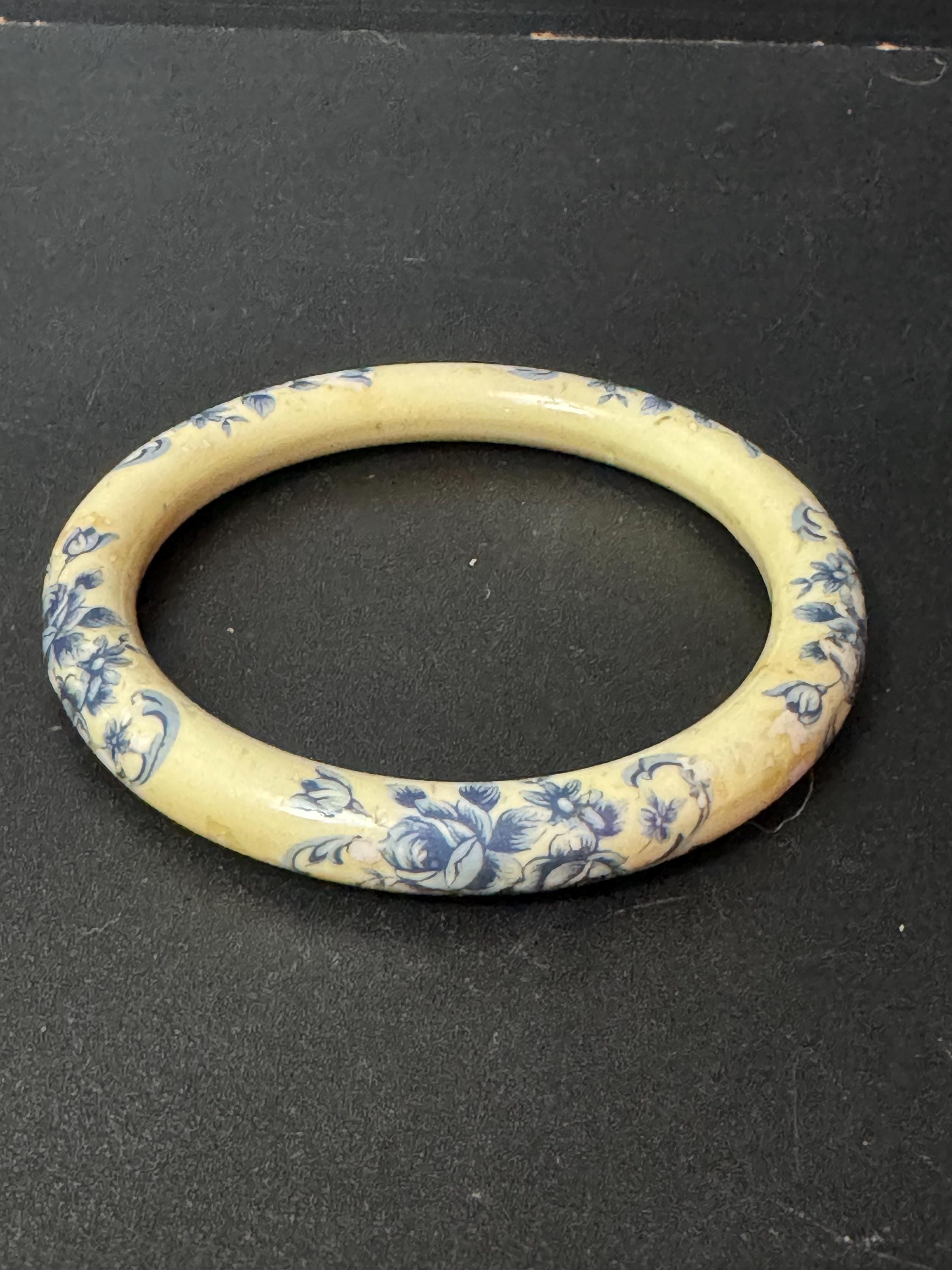Antique ceramic Art Deco Period Cream bangle bracelet transfer printed with blue floral roses