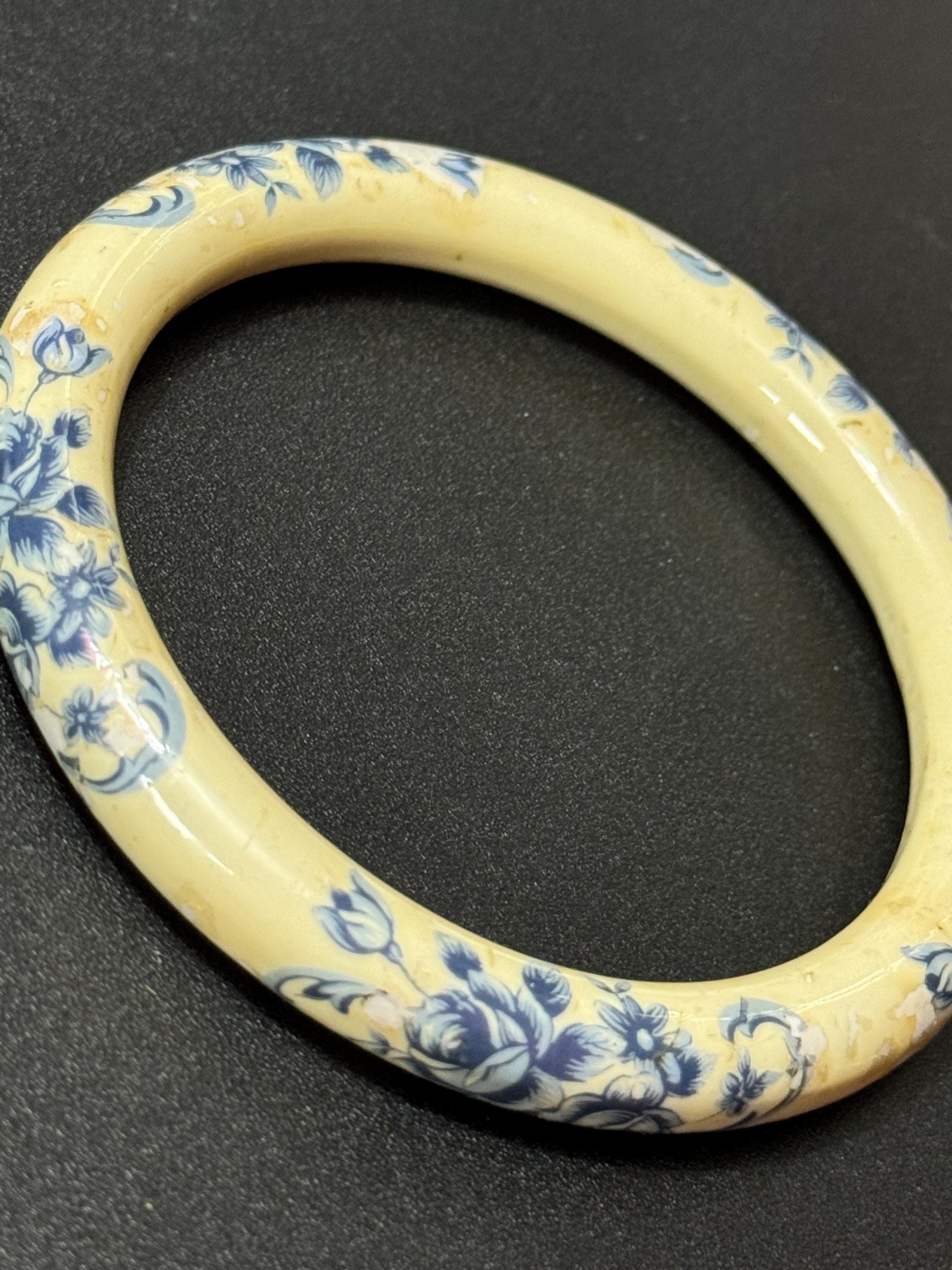 Antique ceramic Art Deco Period Cream bangle bracelet transfer printed with blue floral roses