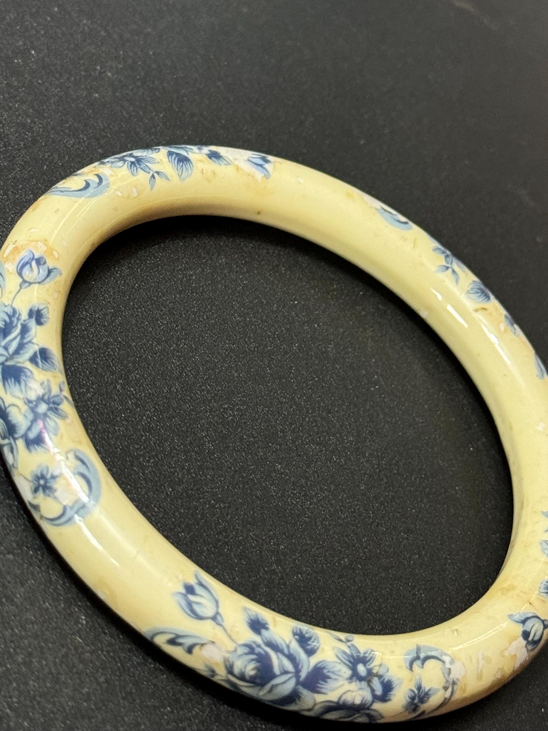 Antique ceramic Art Deco Period Cream bangle bracelet transfer printed with blue floral roses