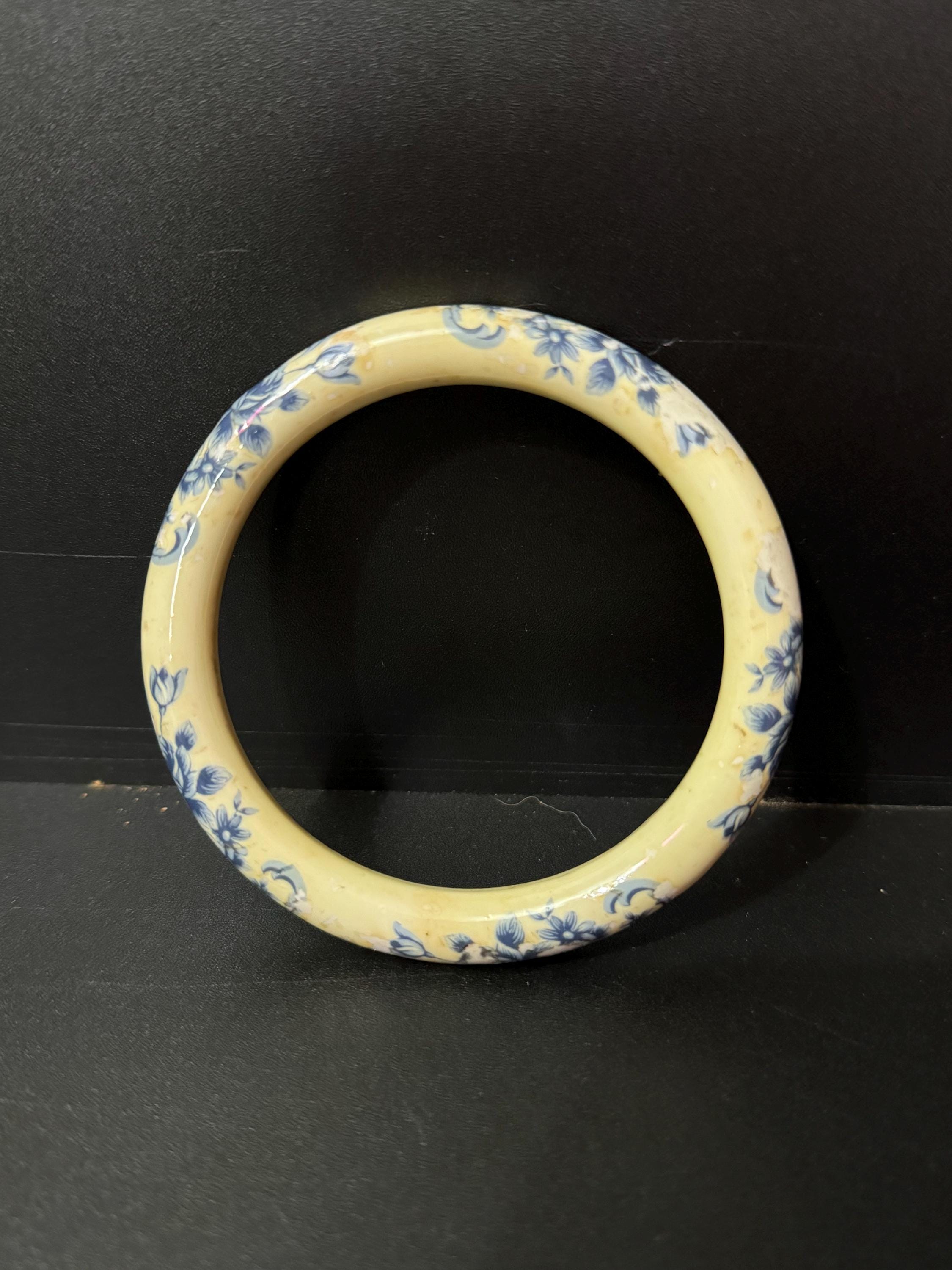 Antique ceramic Art Deco Period Cream bangle bracelet transfer printed with blue floral roses