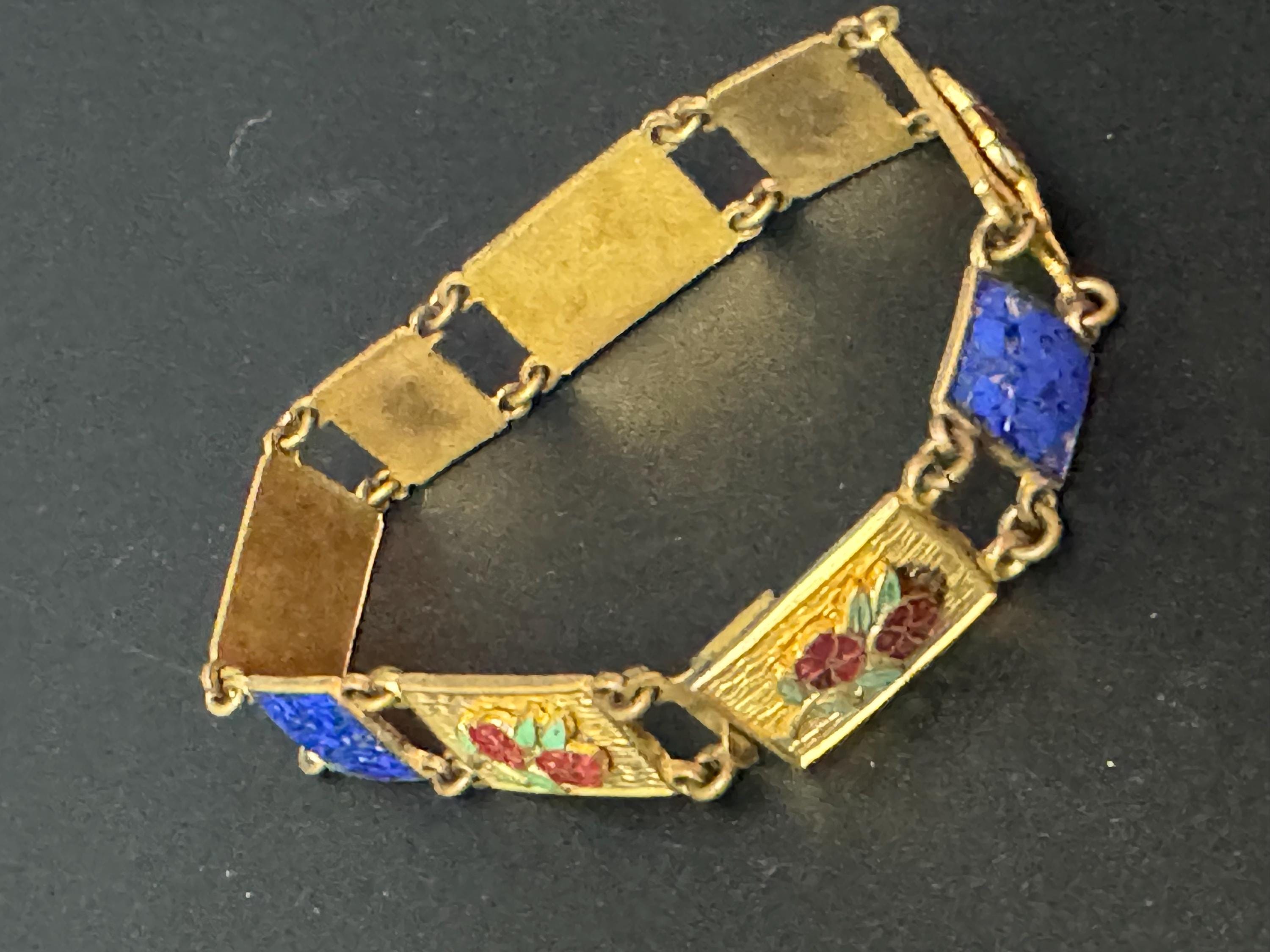 Antique brass enamelled panel link bracelet with blue gold and flower details