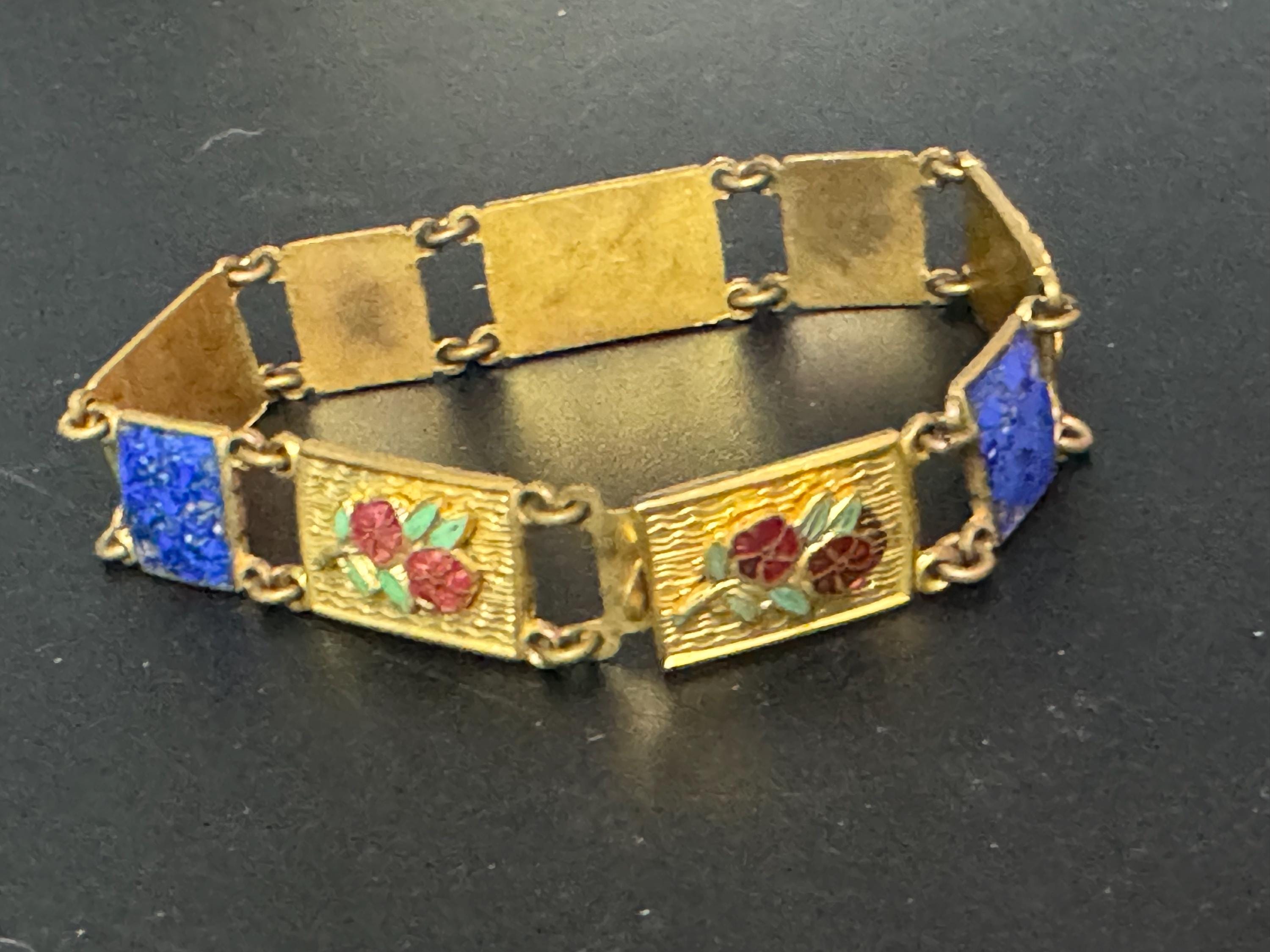 Antique brass enamelled panel link bracelet with blue gold and flower details