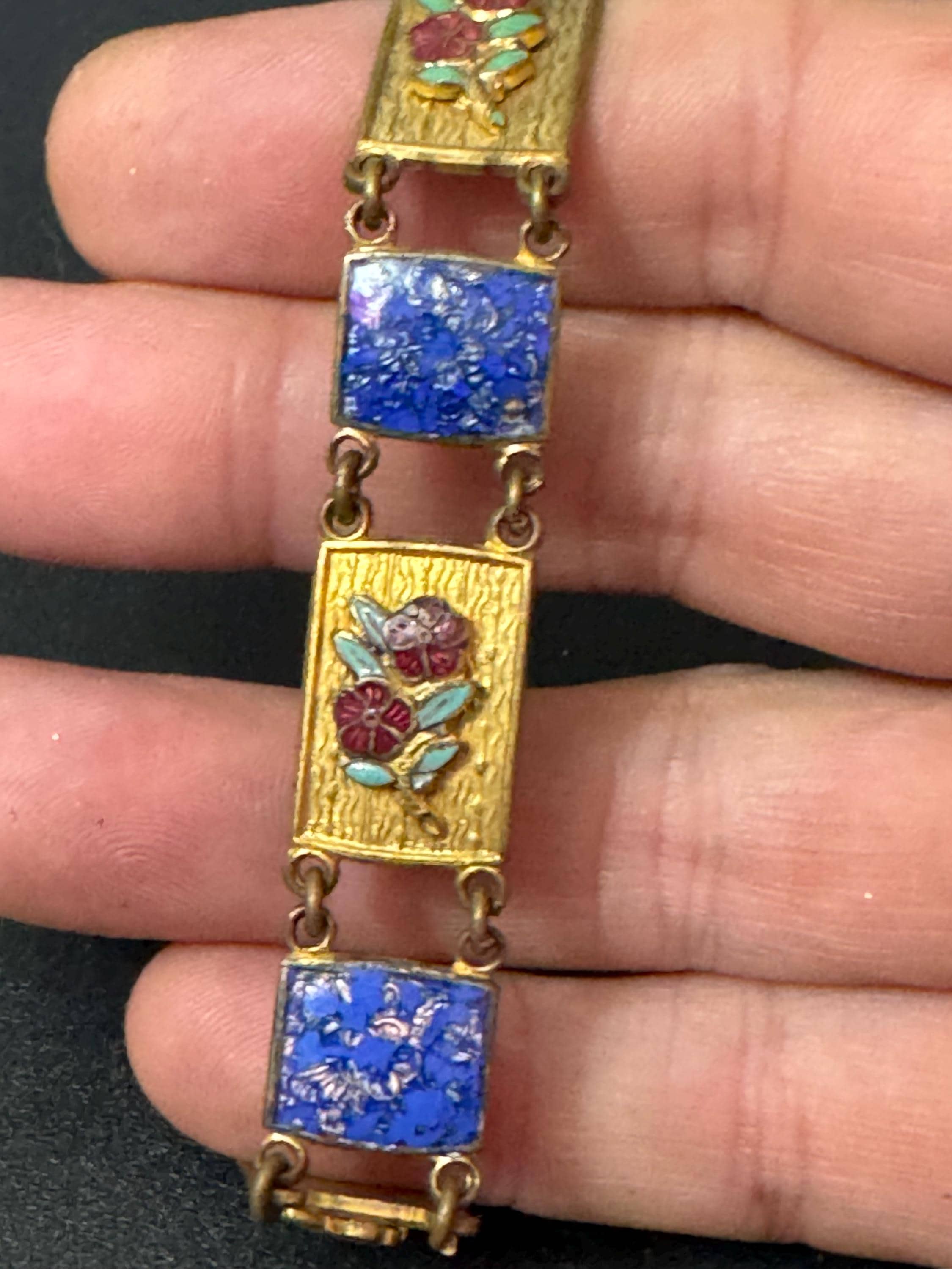 Antique brass enamelled panel link bracelet with blue gold and flower details