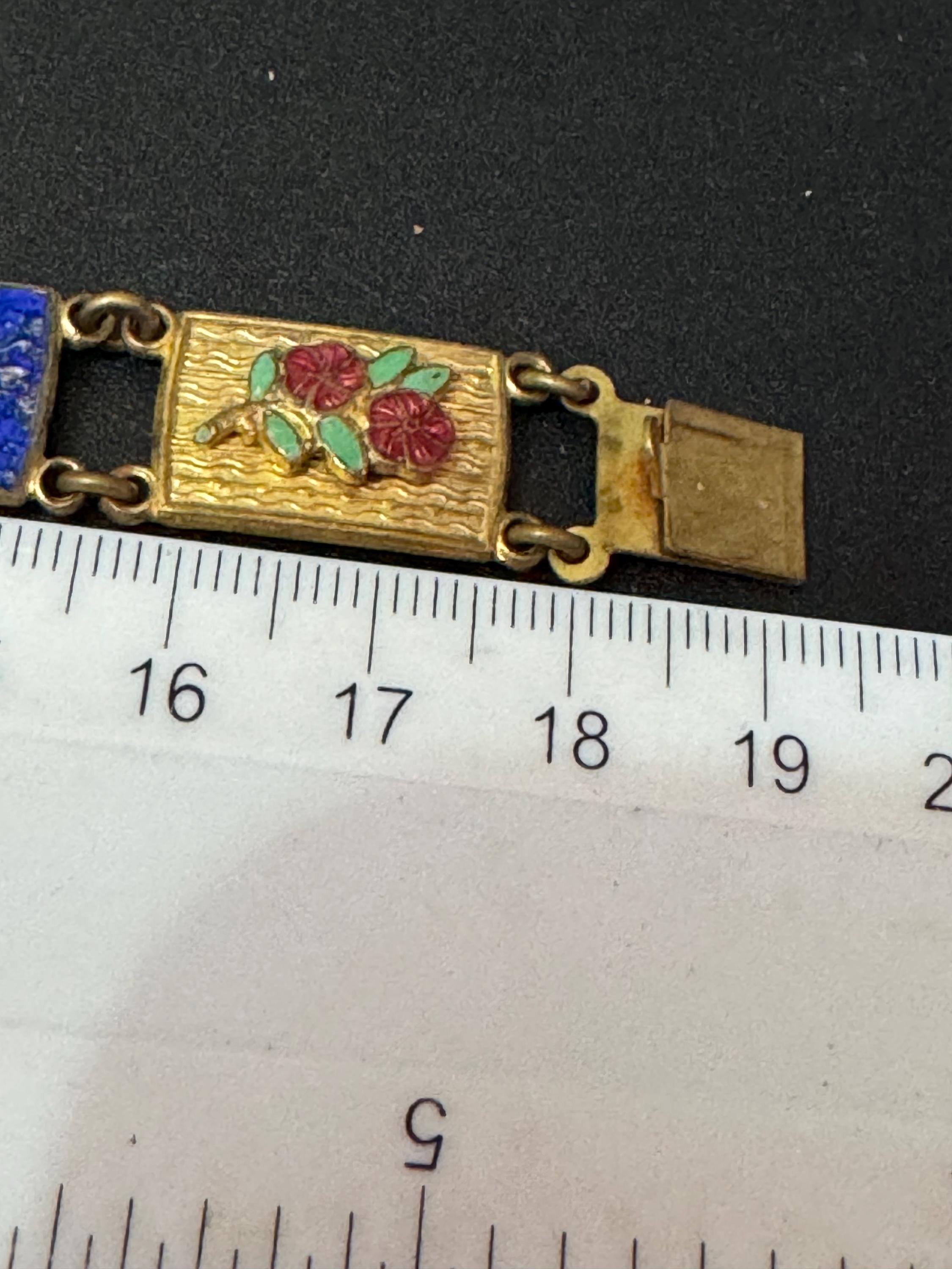 Antique brass enamelled panel link bracelet with blue gold and flower details