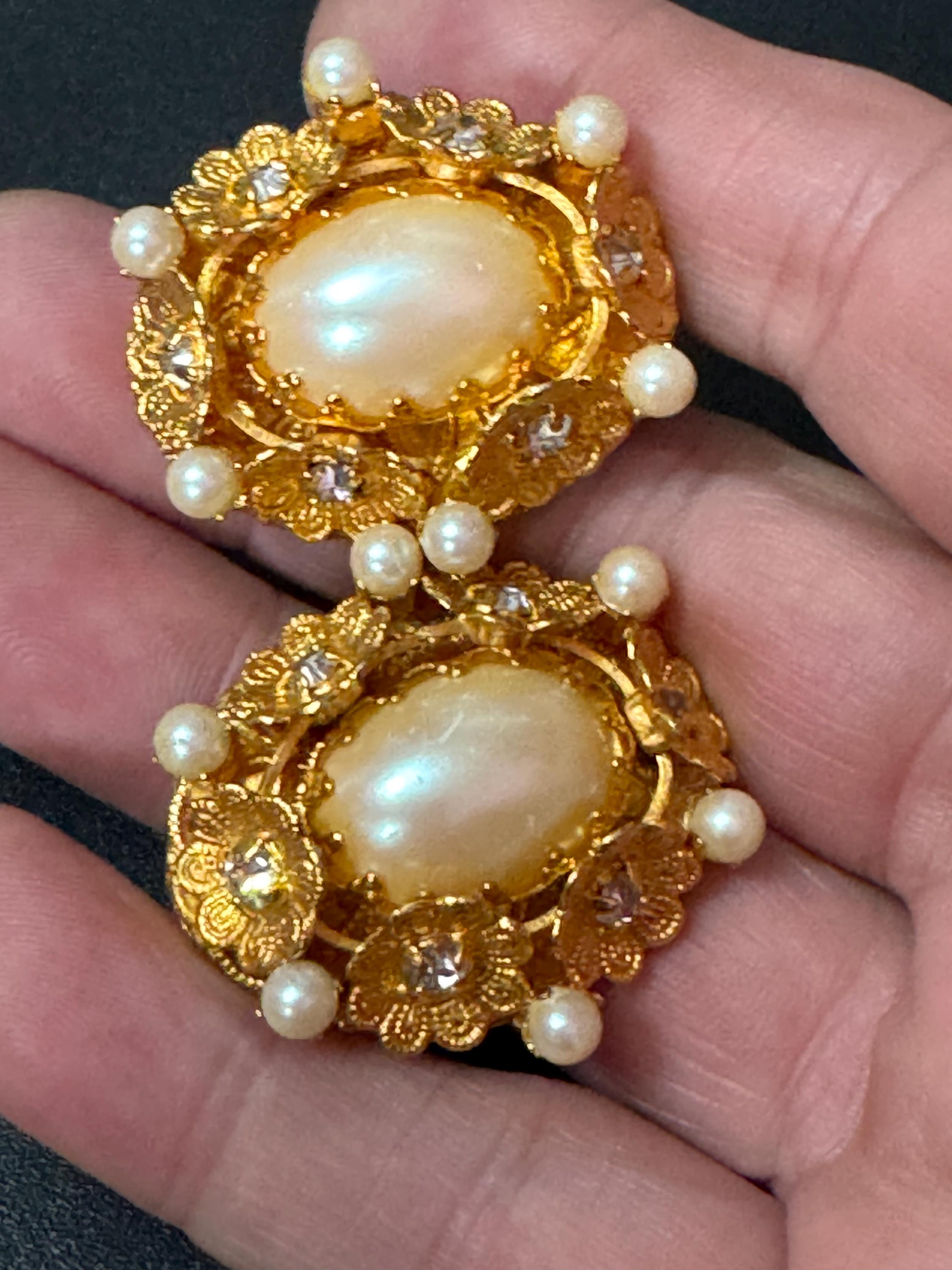 Oversized oval rhinestone and faux Pearl cabochon floral gold tone clip on earrings