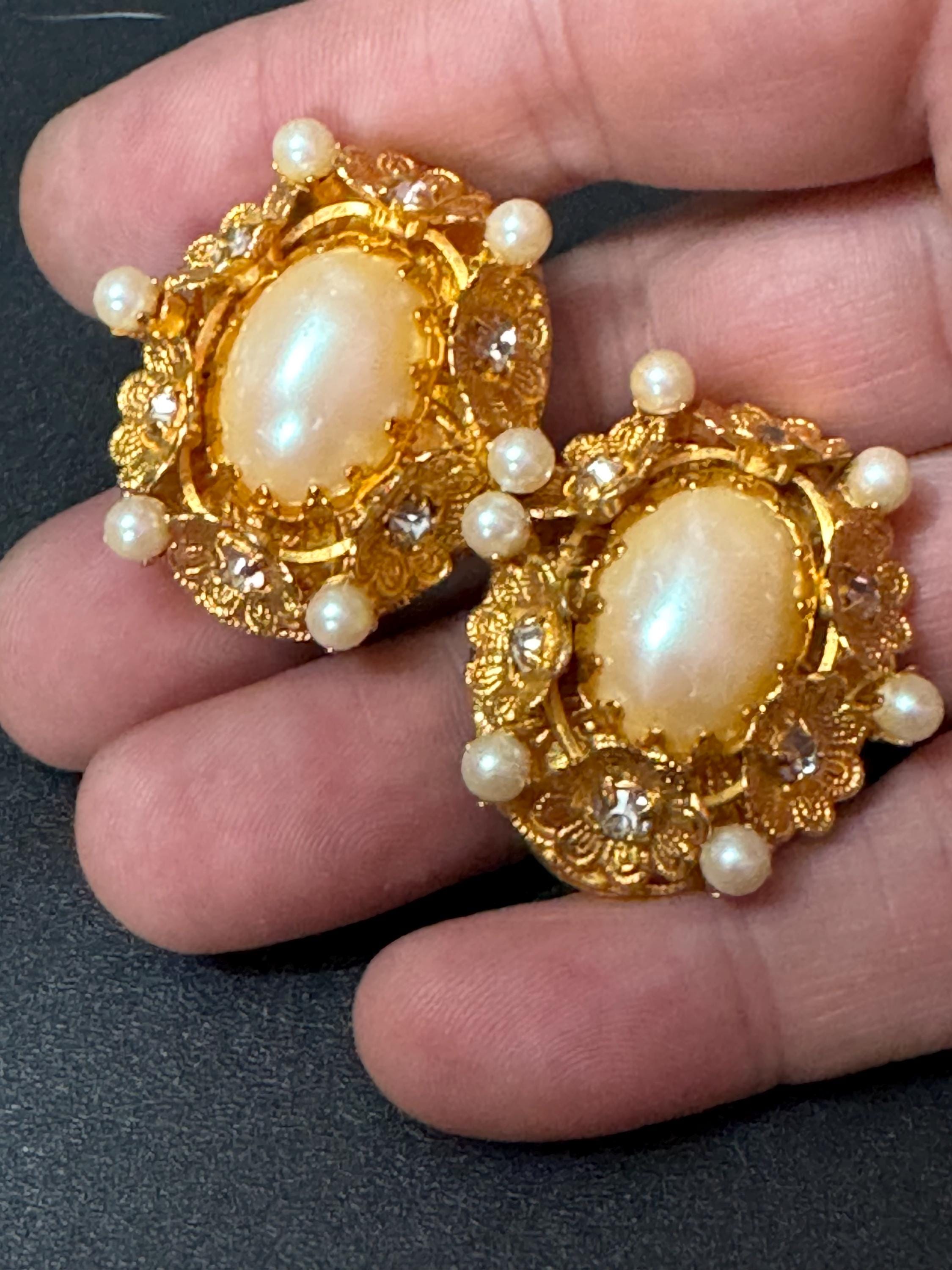 Oversized oval rhinestone and faux Pearl cabochon floral gold tone clip on earrings