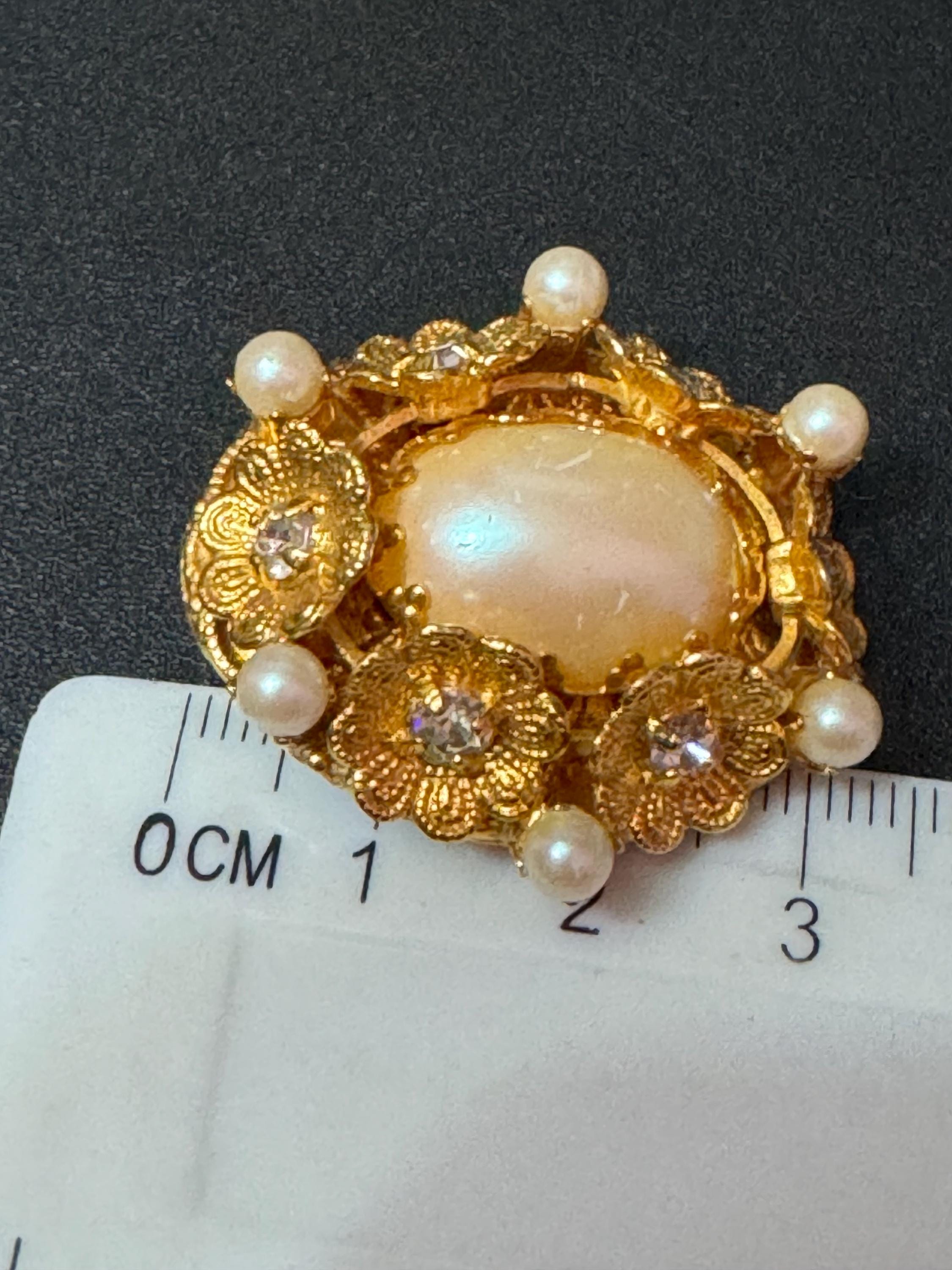 Oversized oval rhinestone and faux Pearl cabochon floral gold tone clip on earrings