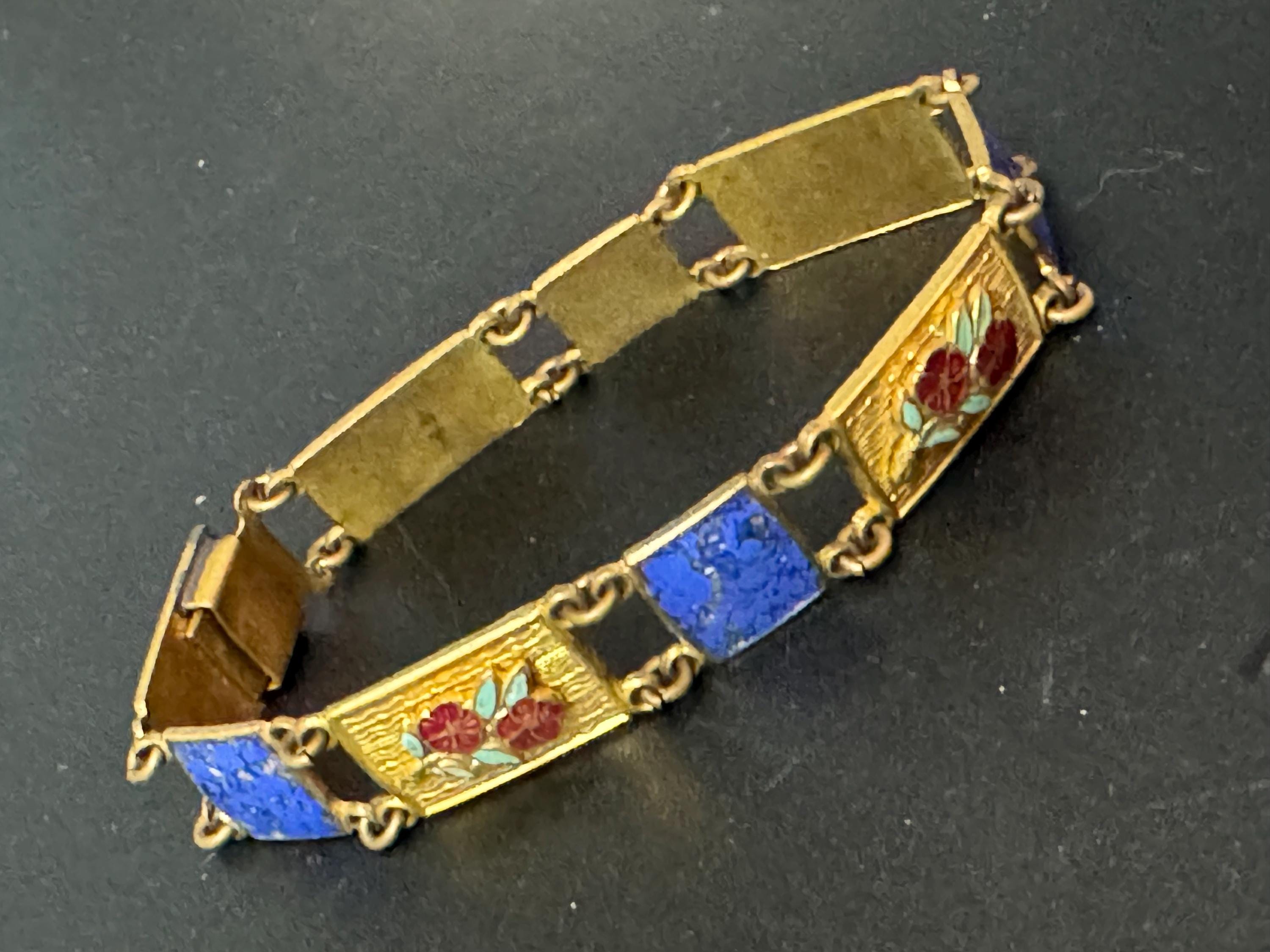 Antique brass enamelled panel link bracelet with blue gold and flower details