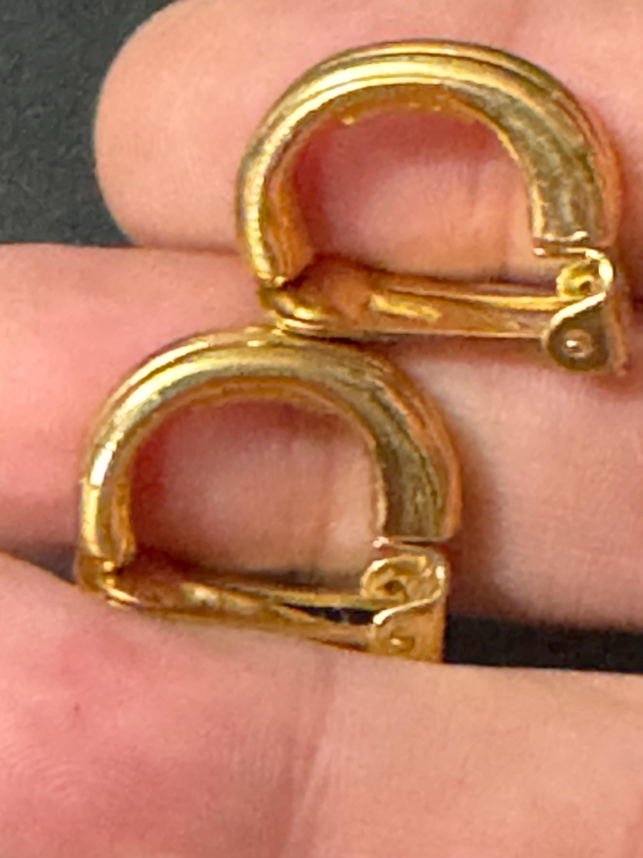 Signed David Grau gold tone half hoop clip on earrings, designer