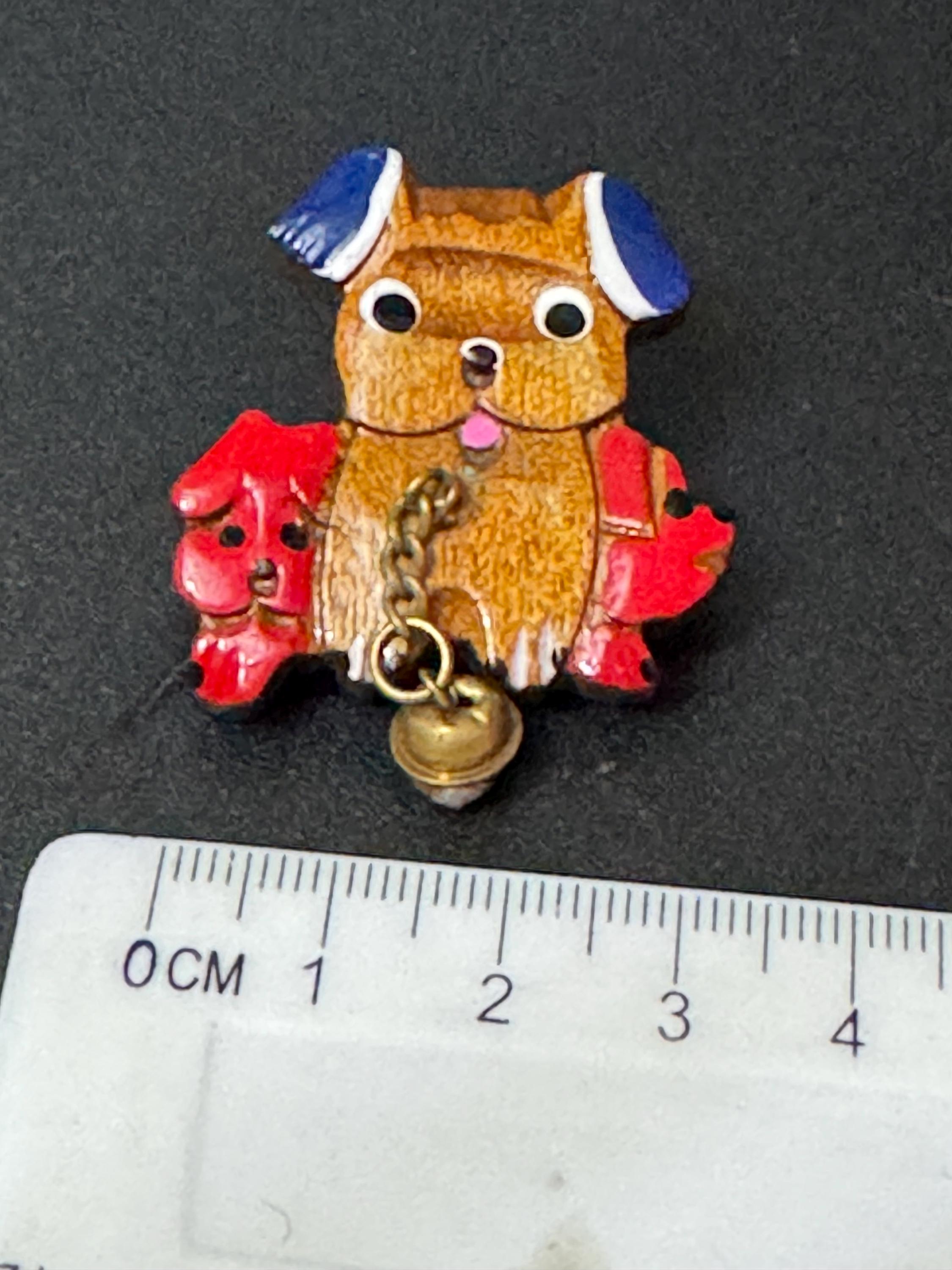 Early wooden brown novelty dog brooch, stamped foreign with brass bells mid century