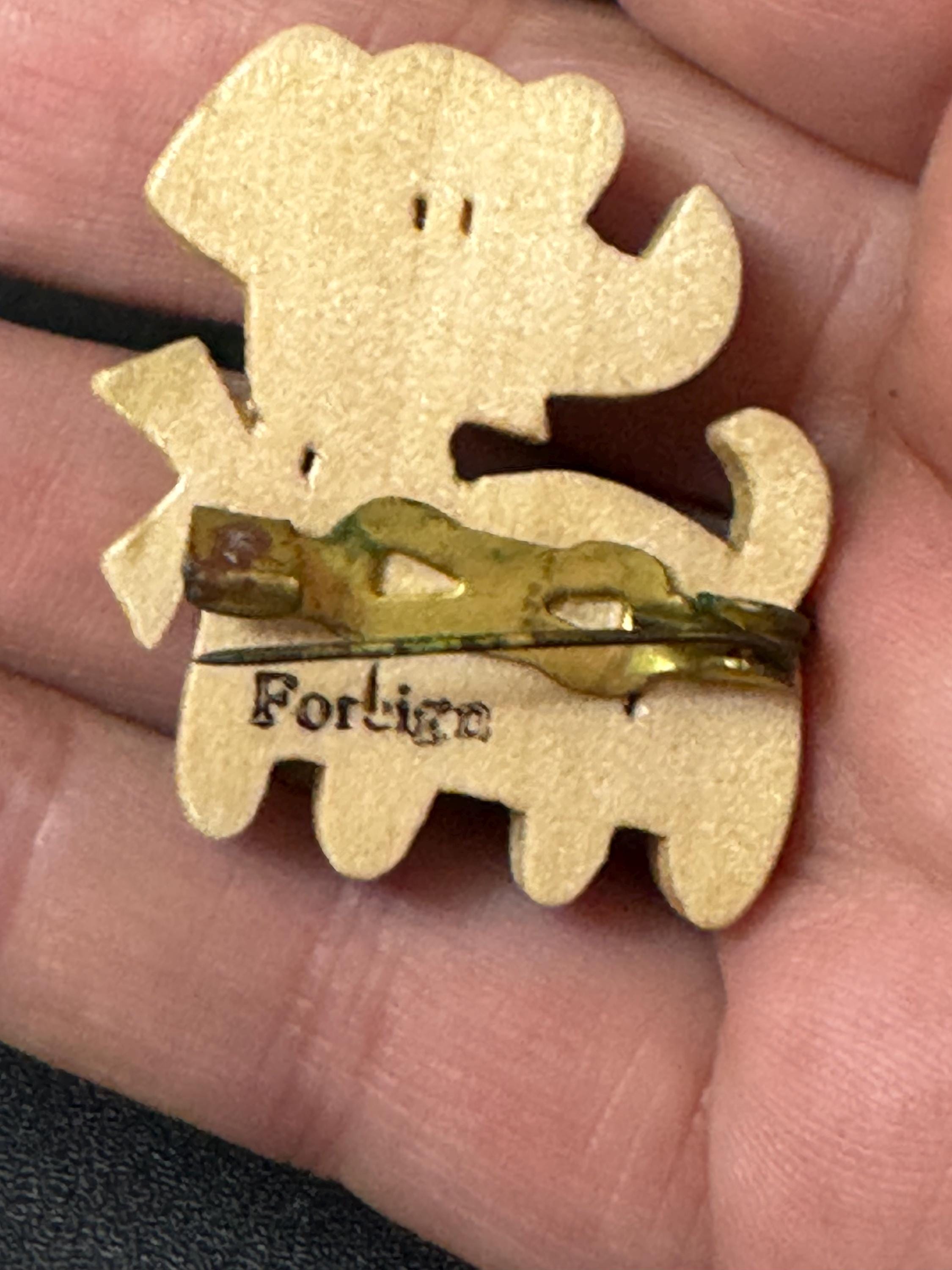 Early wooden light brown novelty dog brooch, stamped foreign with brass bells mid century