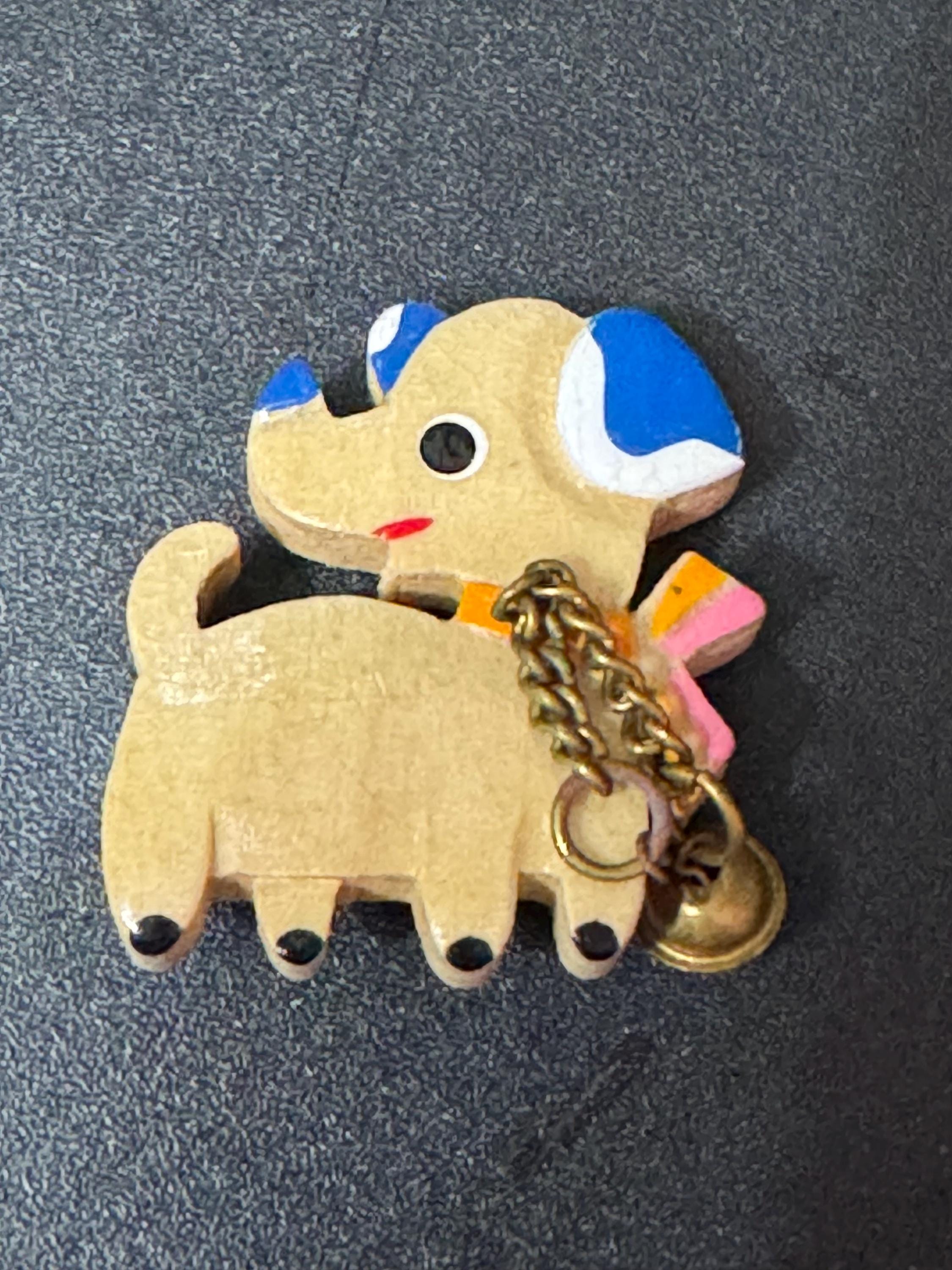 Early wooden light brown novelty dog brooch, stamped foreign with brass bells mid century
