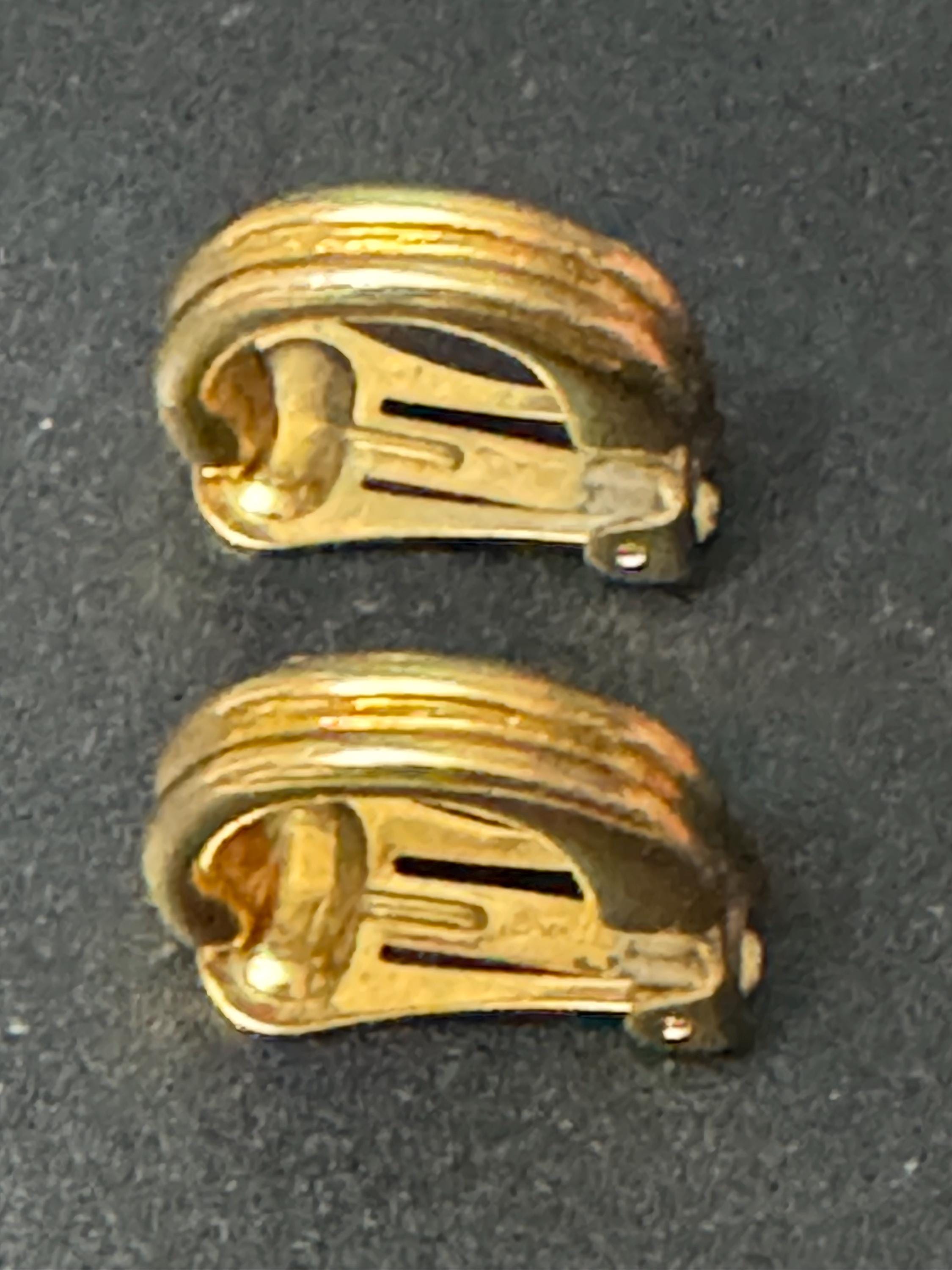 Signed David Grau gold tone half hoop drop clip on earrings, designer