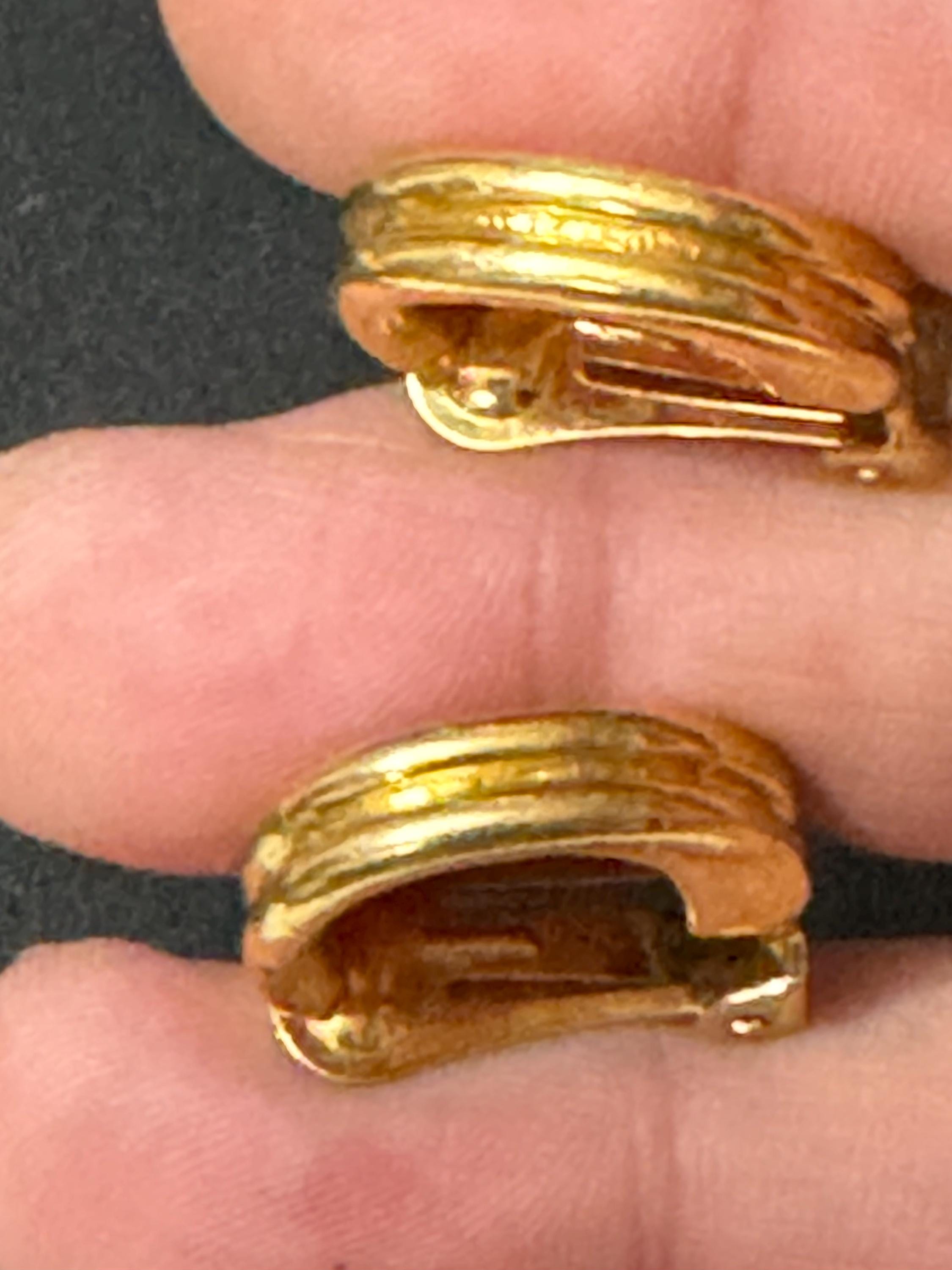 Signed David Grau gold tone half hoop clip on earrings, designer