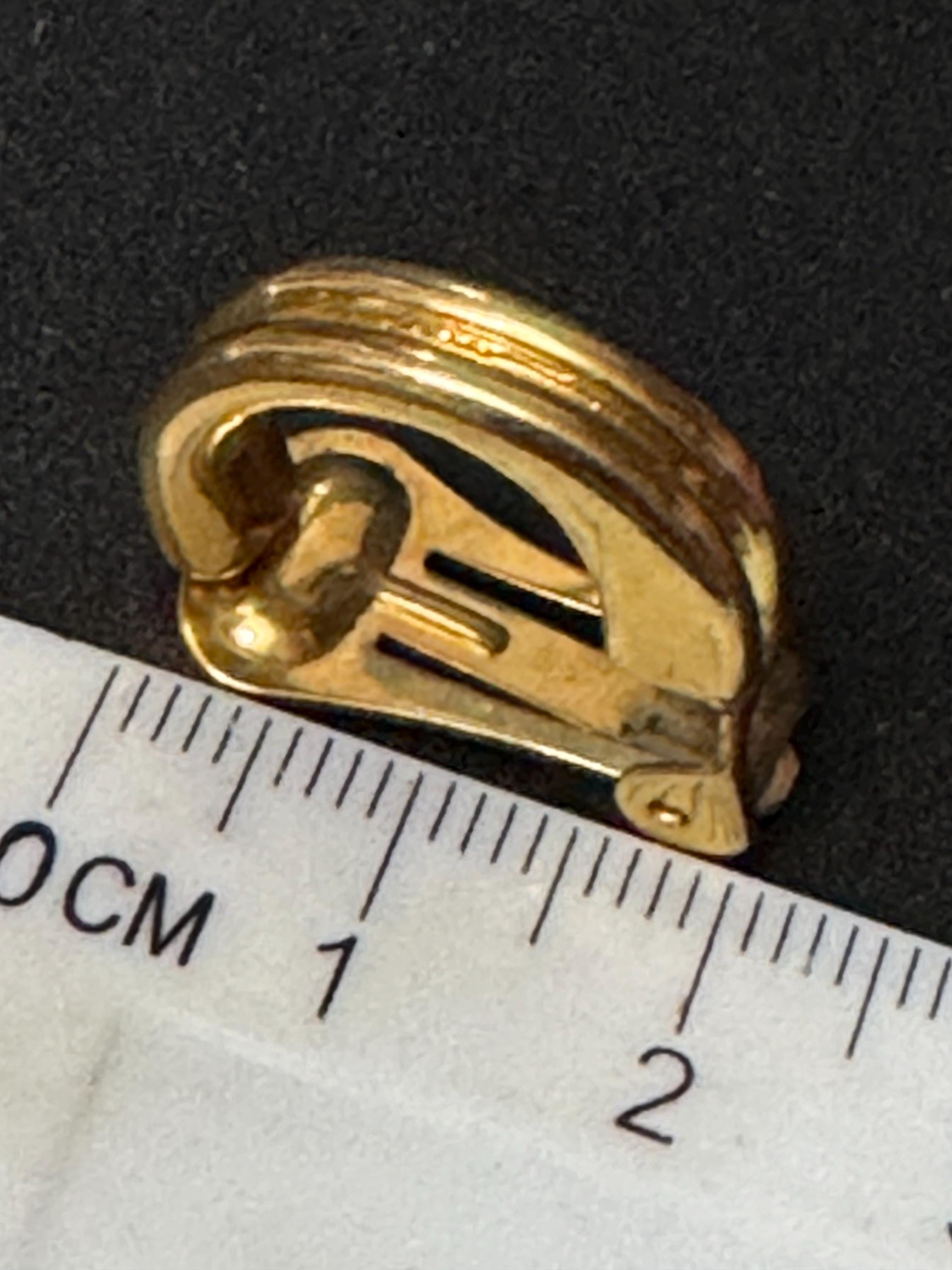 Signed David Grau gold tone half hoop clip on earrings, designer