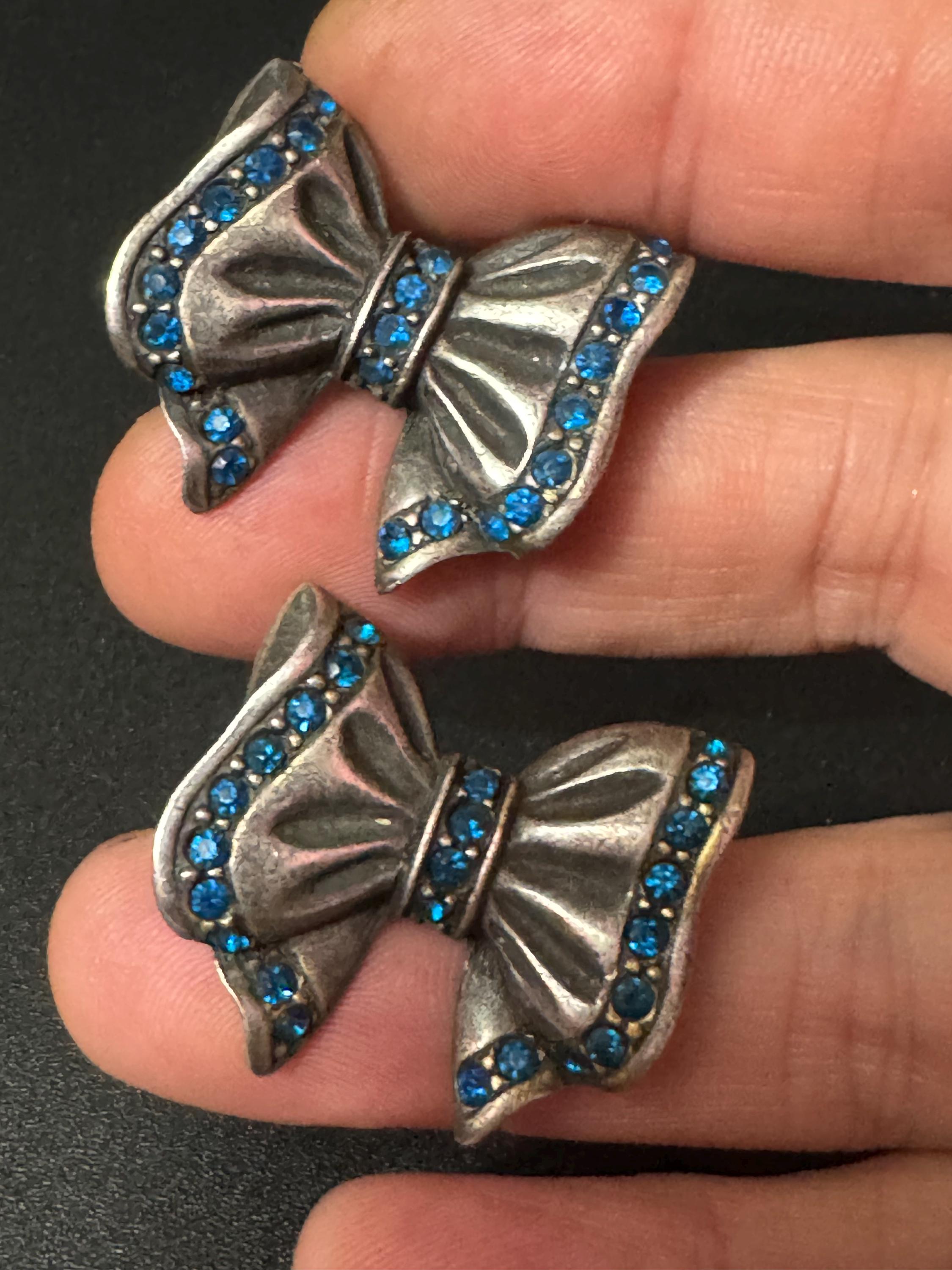 Signed ASKEW Oversized sapphire blue diamanté ribbon bow Antique silver tone pierced stud earrings