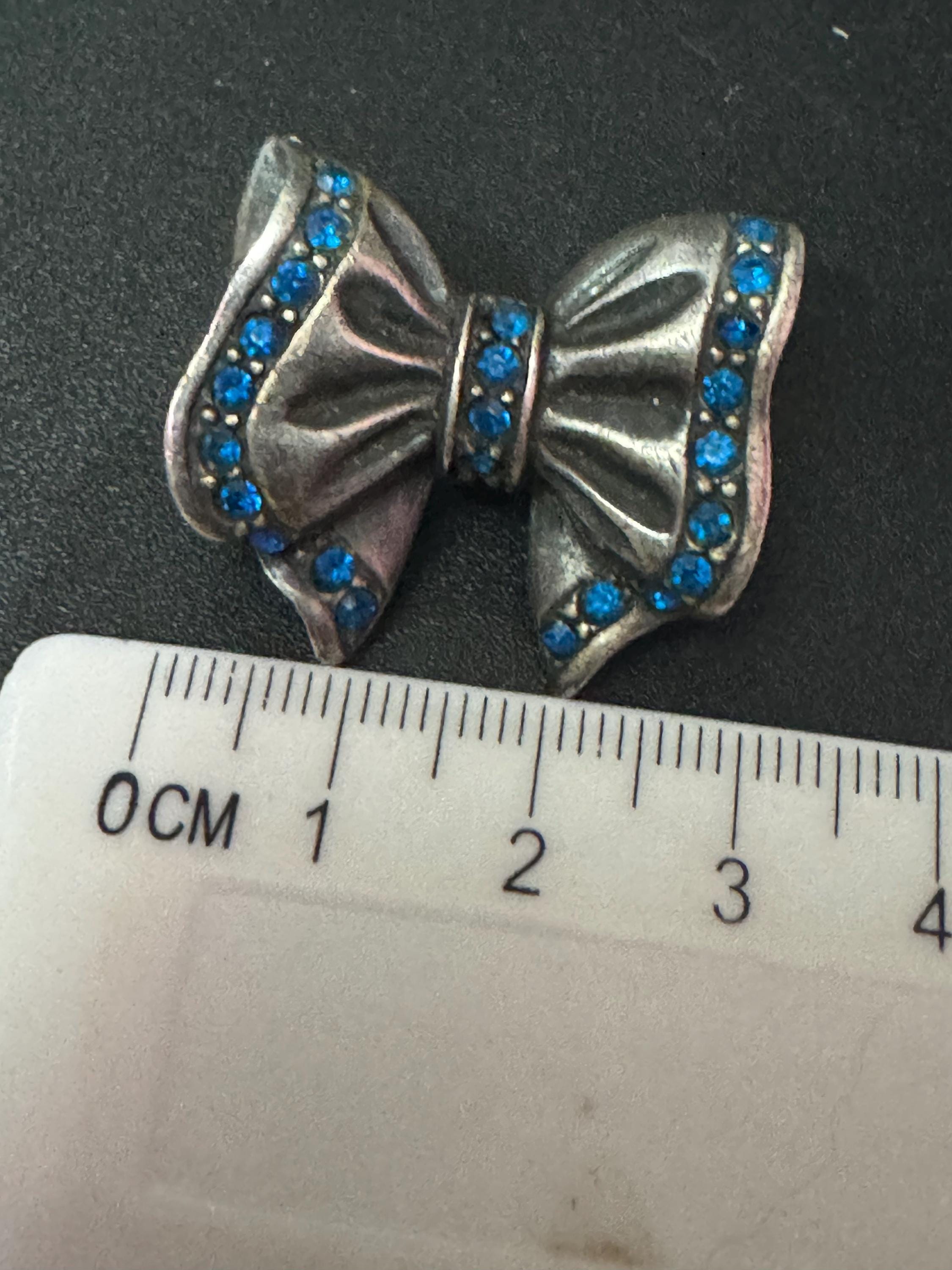 Signed ASKEW Oversized sapphire blue diamanté ribbon bow Antique silver tone pierced stud earrings