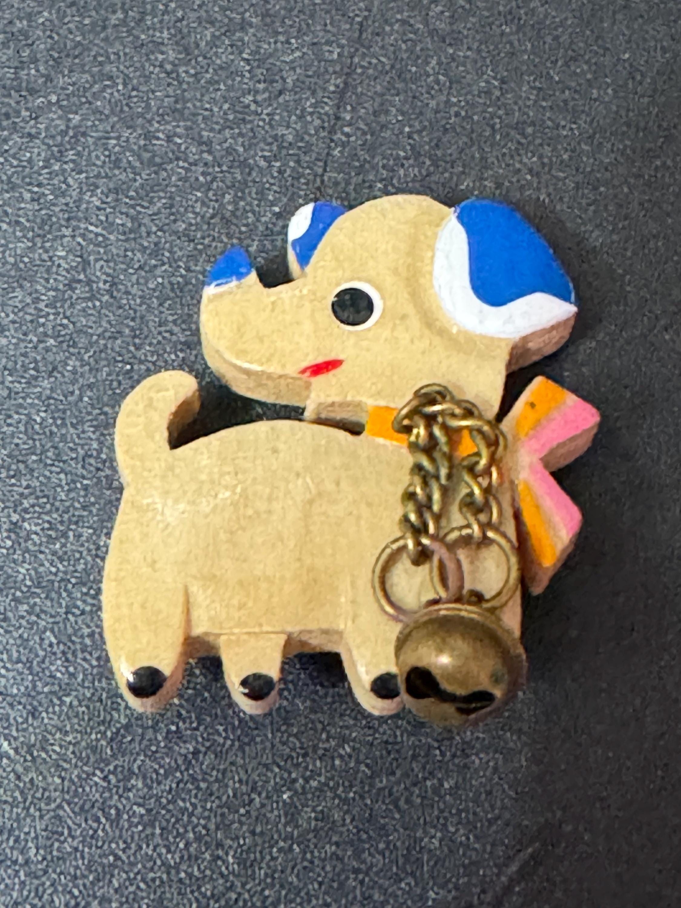 Early wooden light brown novelty dog brooch, stamped foreign with brass bells mid century
