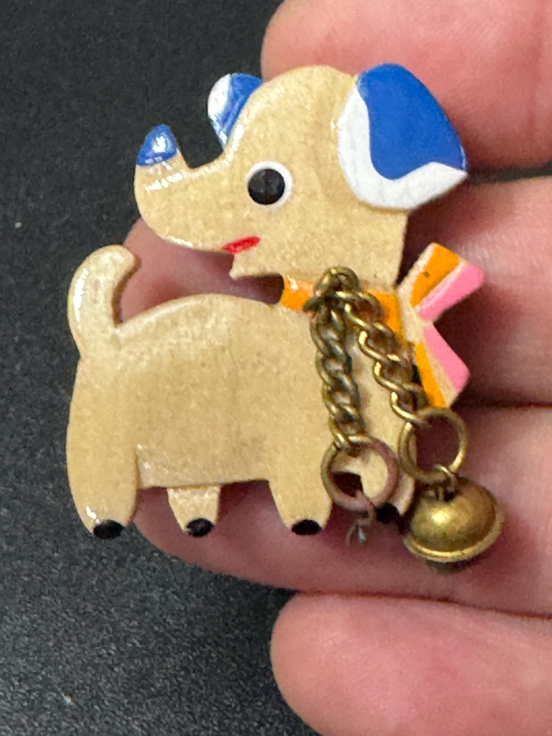 Early wooden light brown novelty dog brooch, stamped foreign with brass bells mid century
