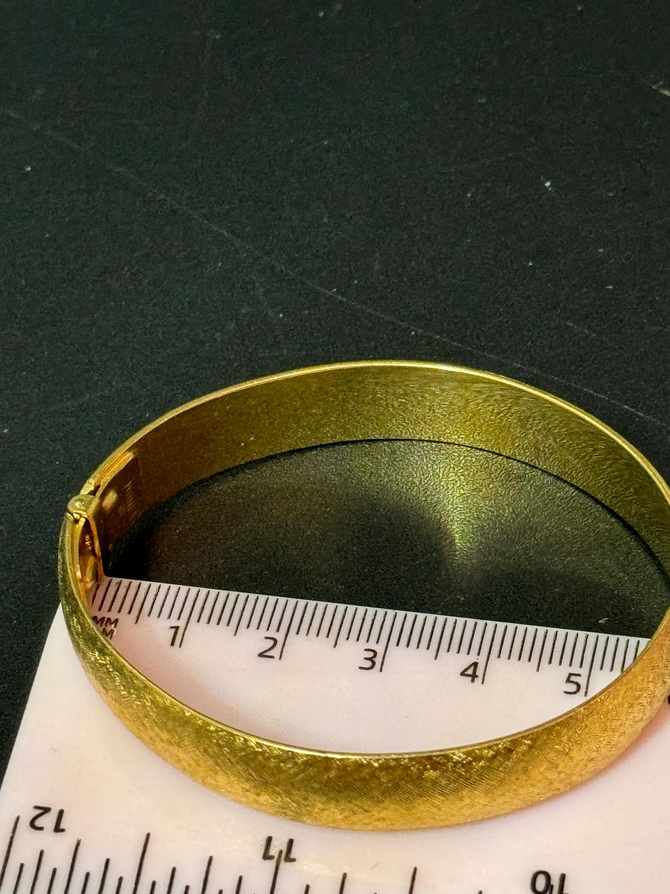 designer MONET signed brushed gold tone 1cm wide hinged clamper bangle bracelet