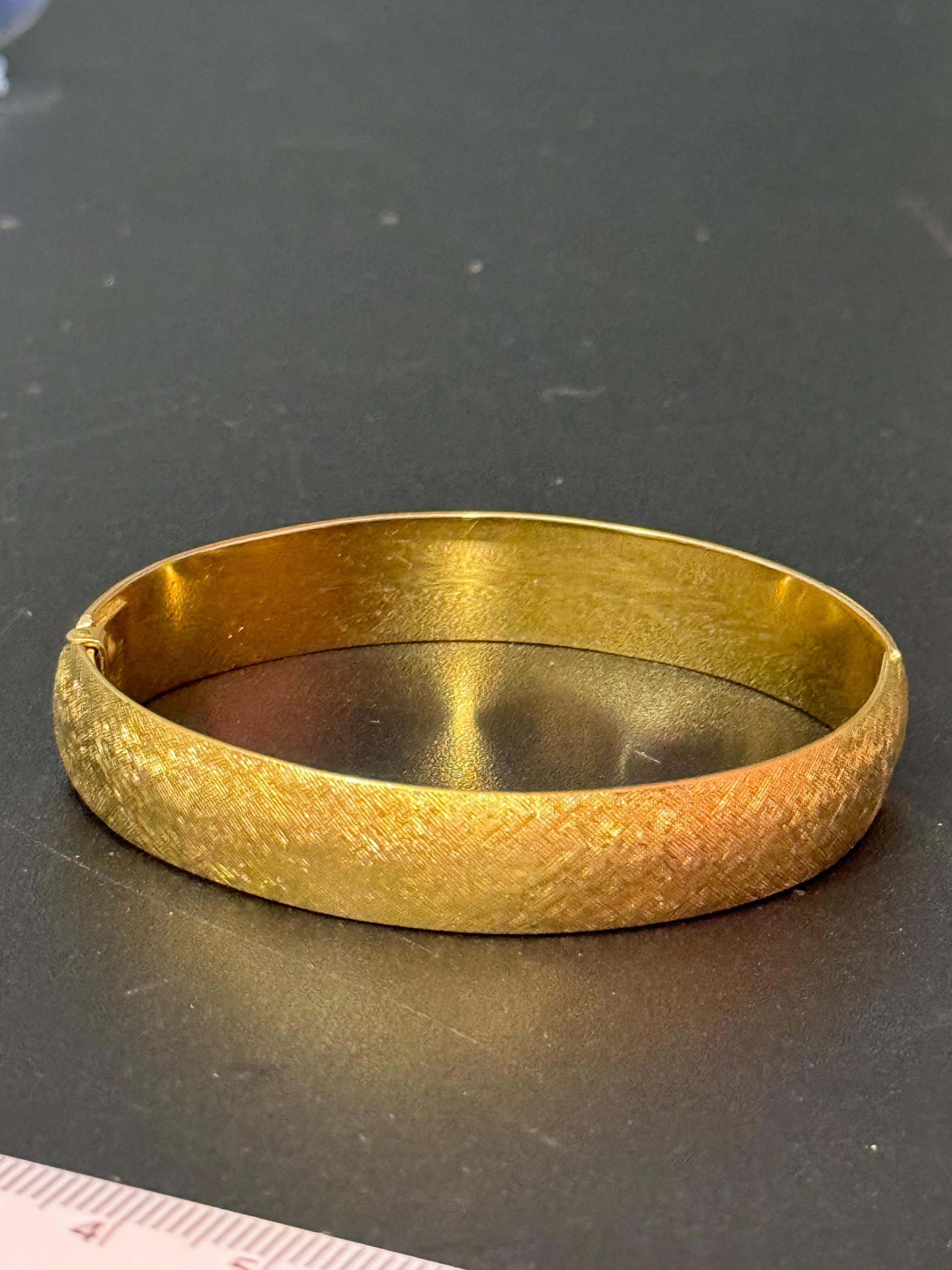 designer MONET signed brushed gold tone 1cm wide hinged clamper bangle bracelet
