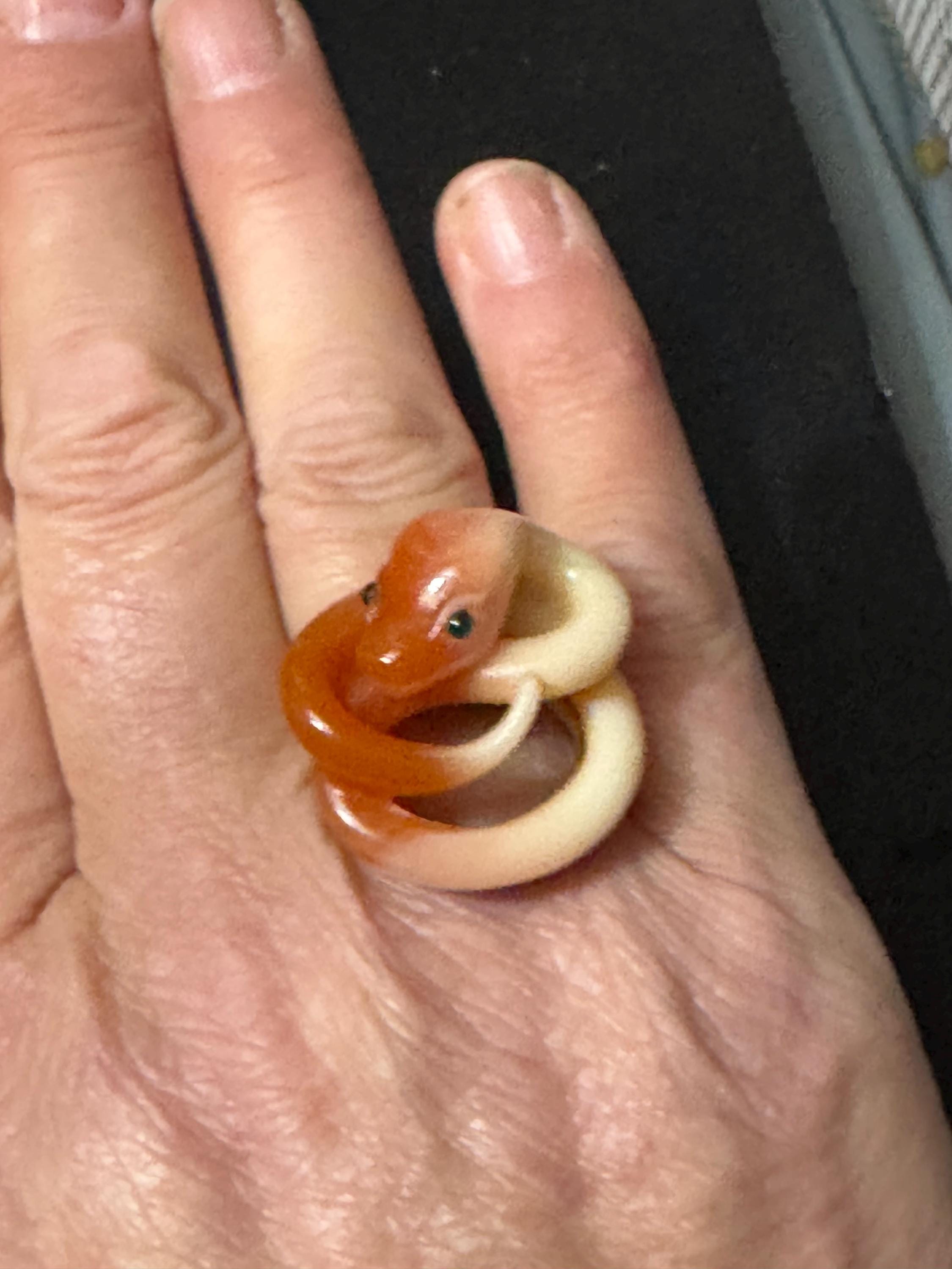 Vintage gold tone orange plastic curled snake ring with emerald eyes adjustable