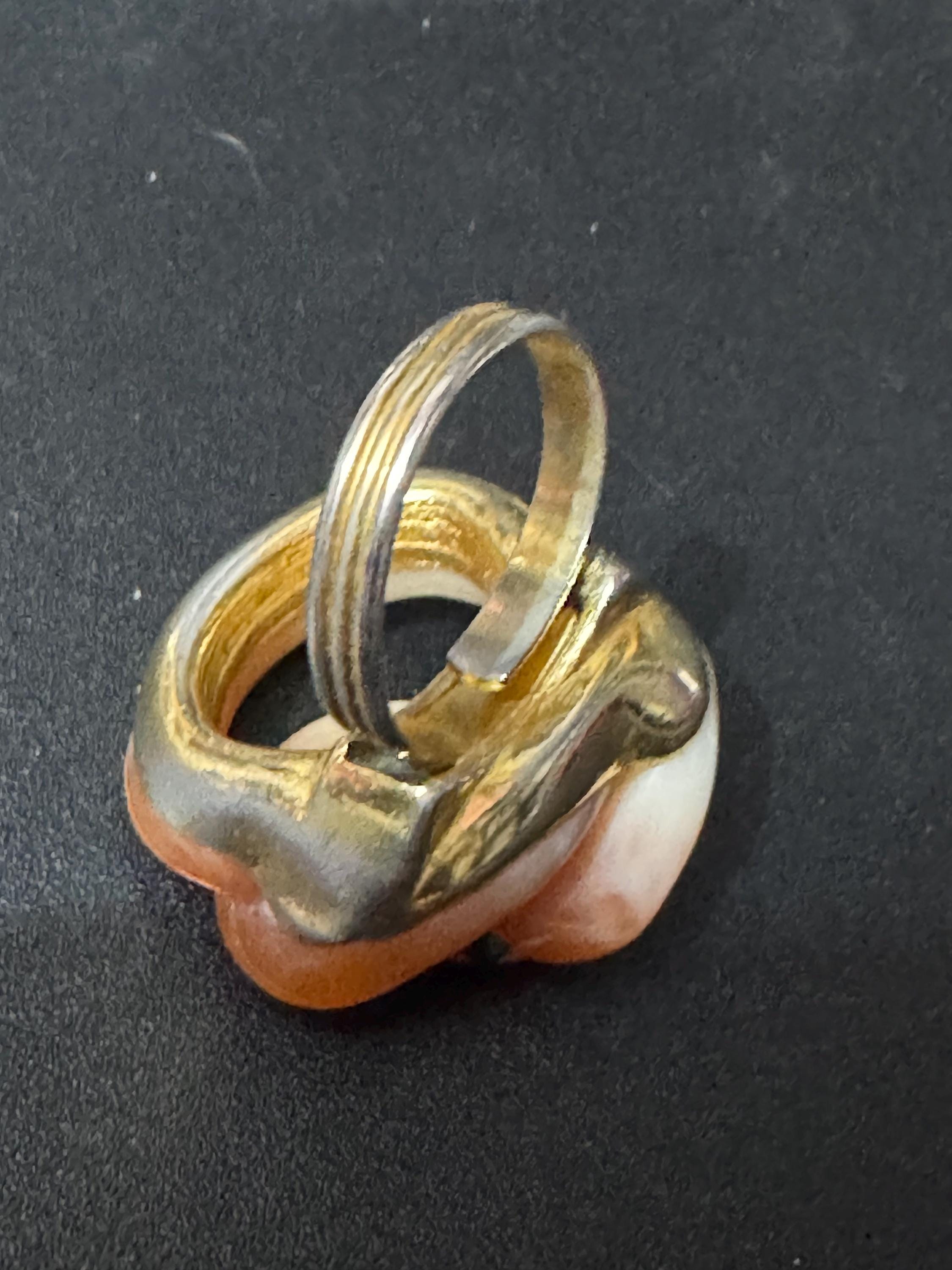 Vintage gold tone orange plastic curled snake ring with emerald eyes adjustable