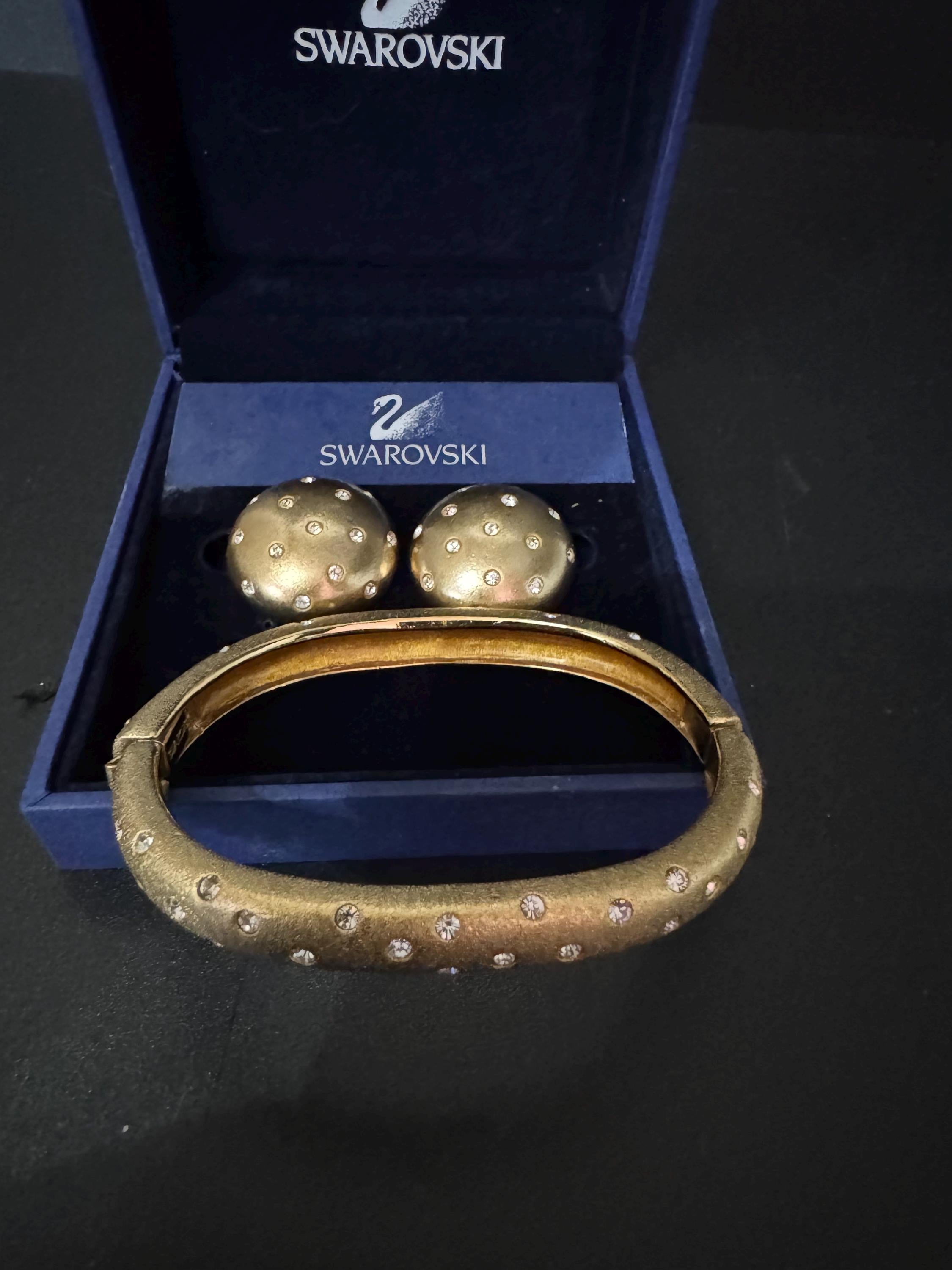 Jewellery set signed swan Swarovski crystal pave set Matt gold plated clamper bangle and matching button clip on earrings