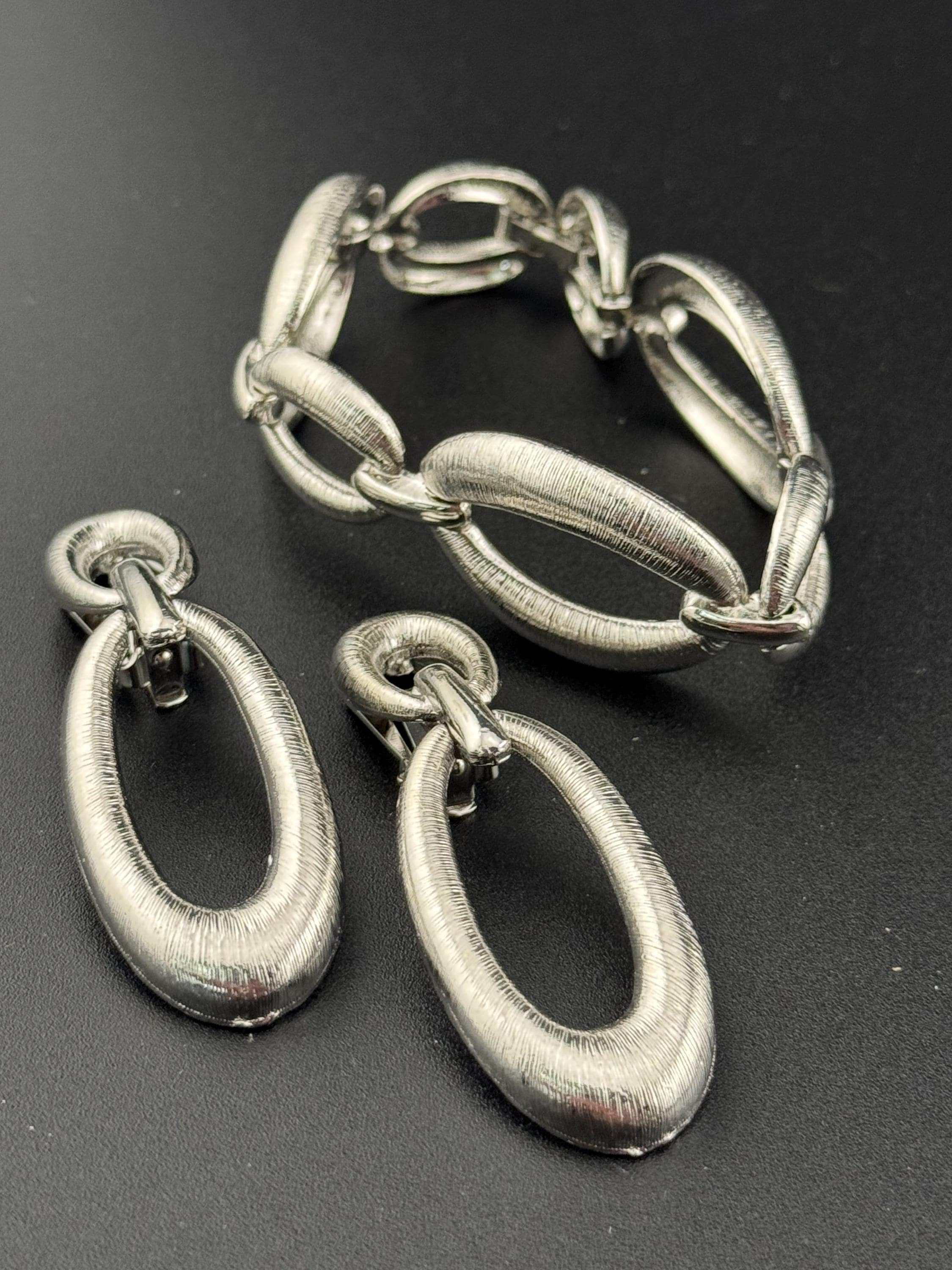 True vintage silver tone textured panel link bracelet and matching clip on drop earrings