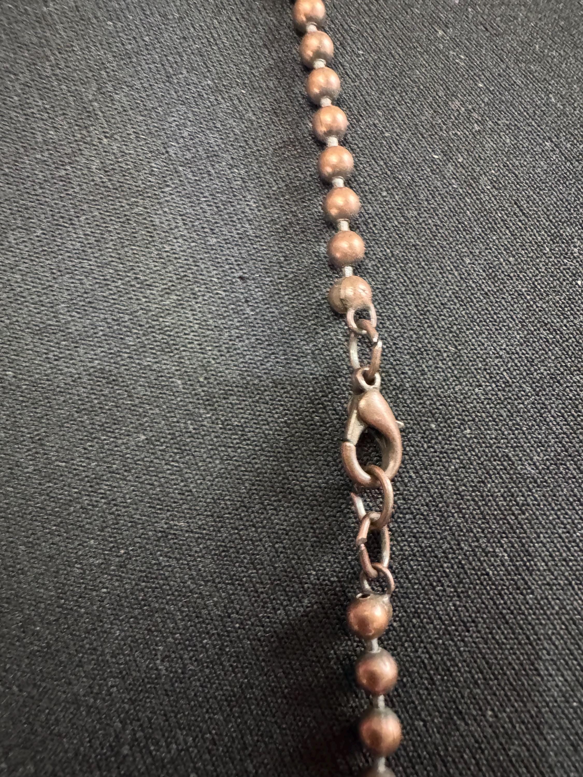 Vintage c 1980s copper tone fish pendant on a 75cm ball bead long chain necklace, blue glass eyes on both sides