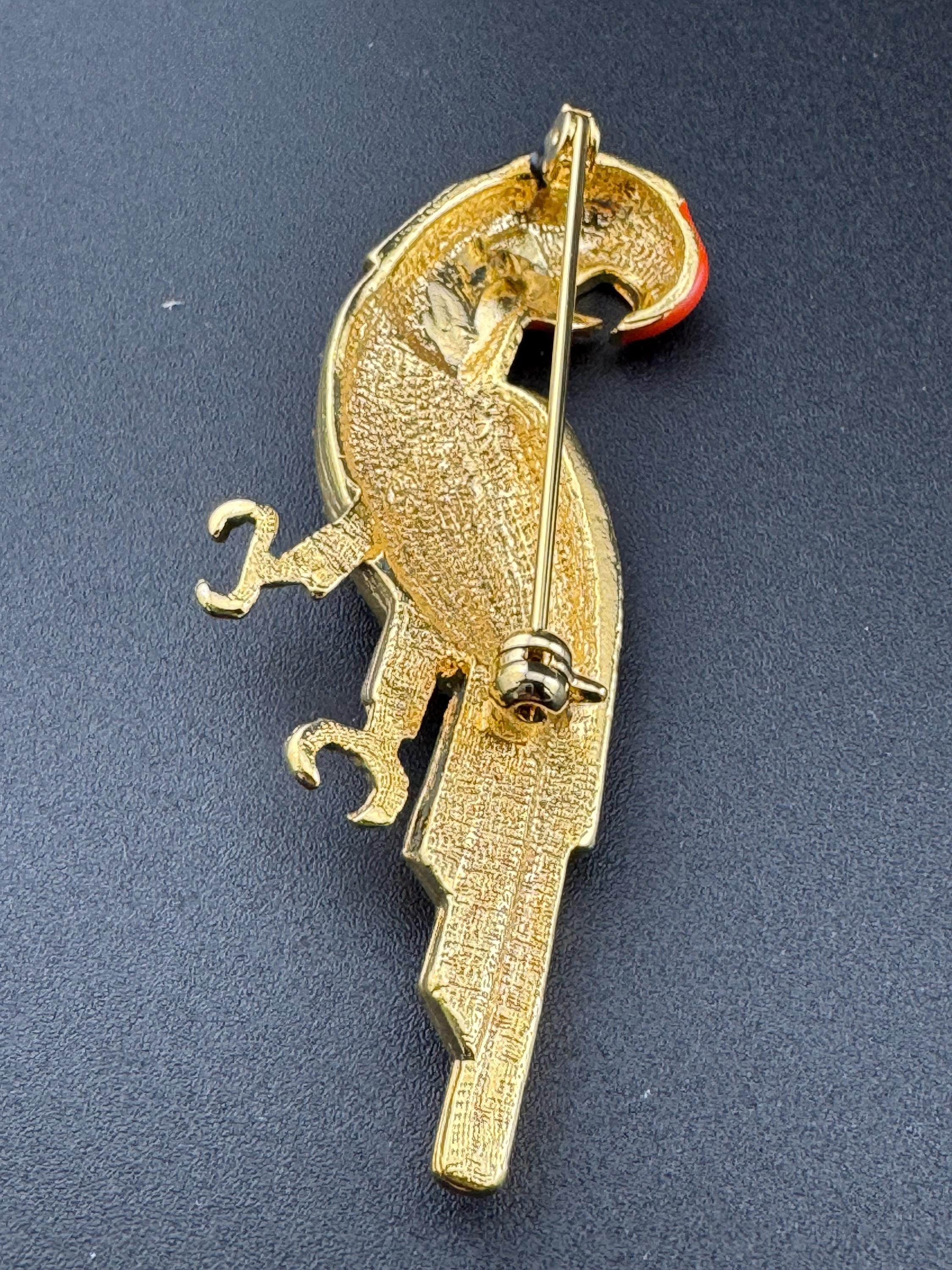 Vintage Tropical Parrot brooch set with Paste diamanté and black orange Enamel gold tone metal 1980s