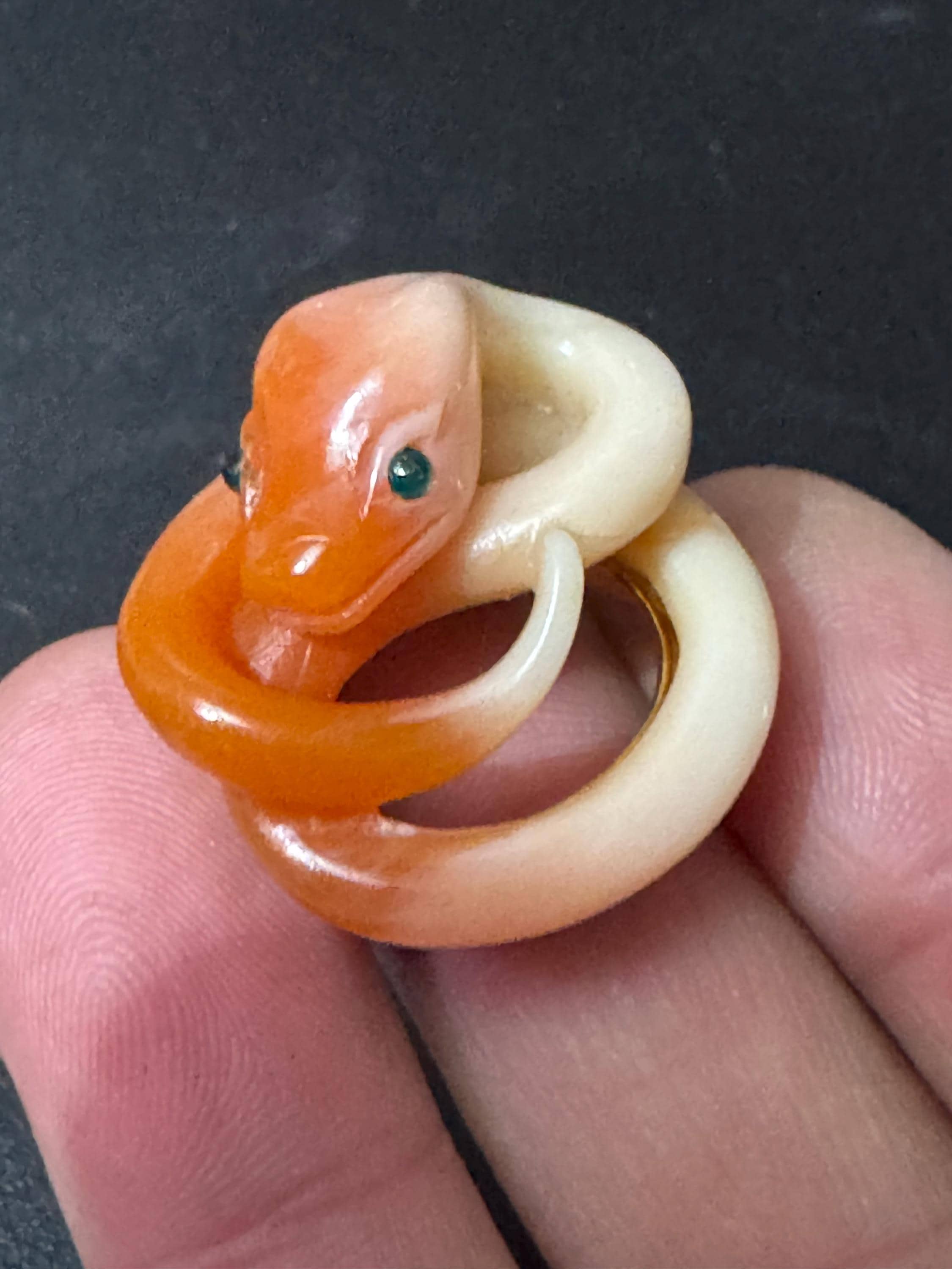 Vintage gold tone orange plastic curled snake ring with emerald eyes adjustable