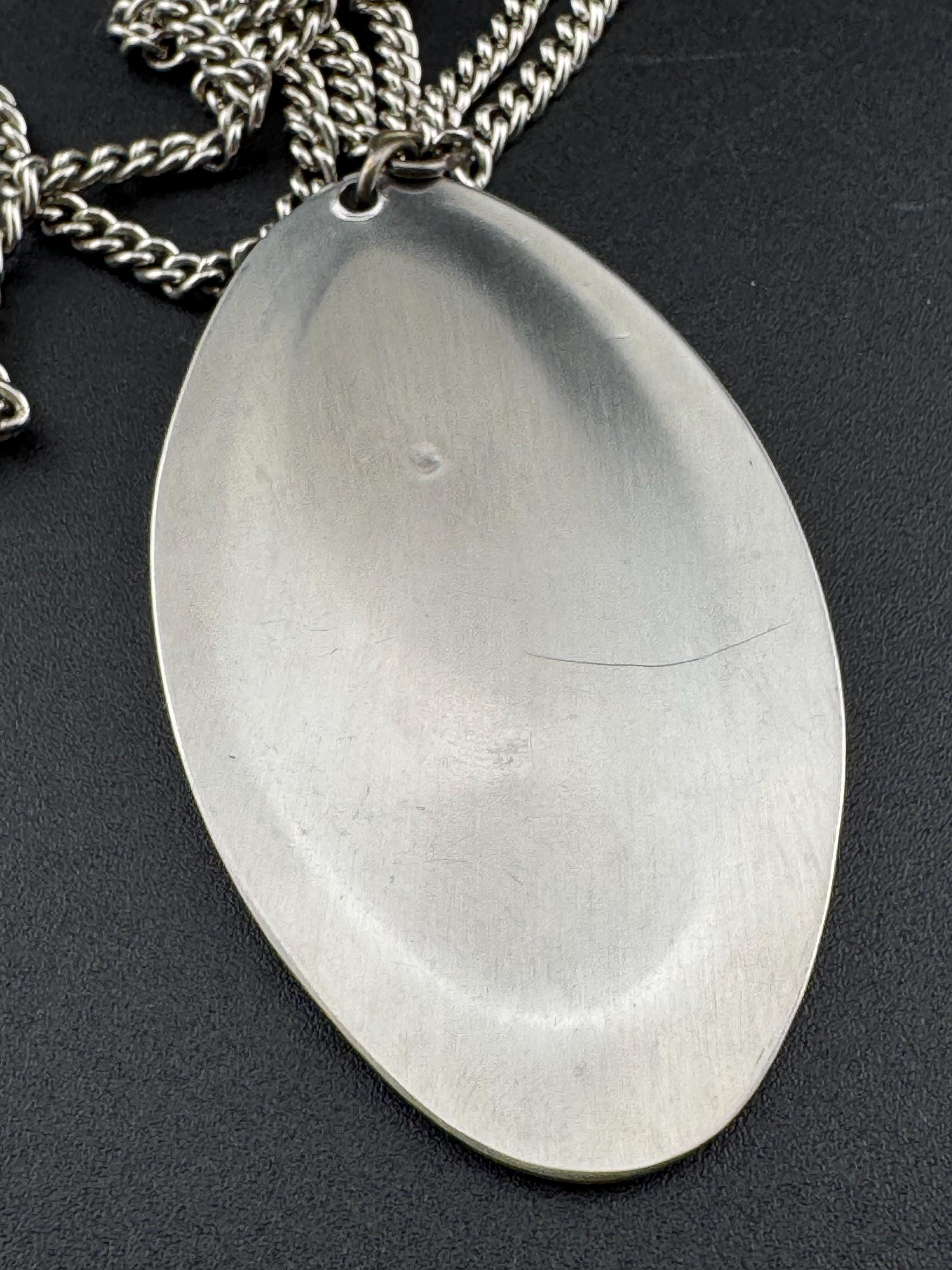 Vintage Modernist silver tone stainless steel pendant necklace and chain set with central pink taupe cabochon 1970s